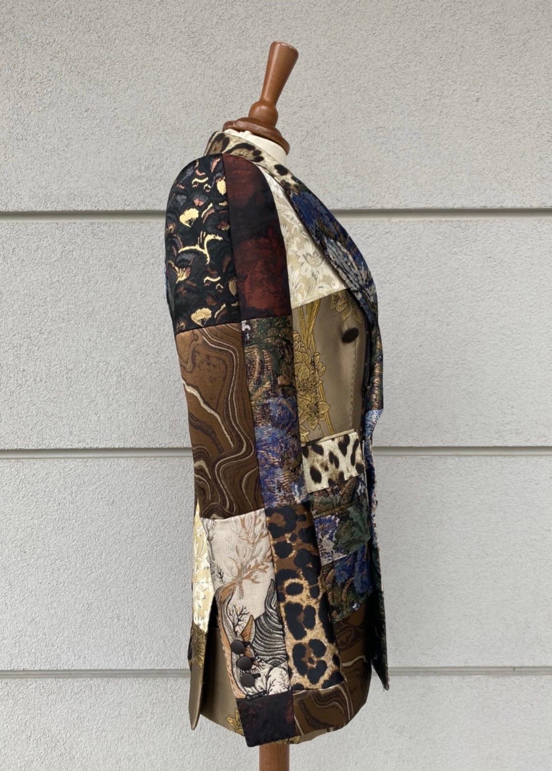 Dolce & Gabbana jacket + gilet. 
the jacket is an Italian size 38 the gilet is an Italian size 42.
Featuring mixed material and pattern with golden and metallic parts.
jacket measurements size 38: shoulder 42cm sleeve 62cm chest 39cm length 73cm.