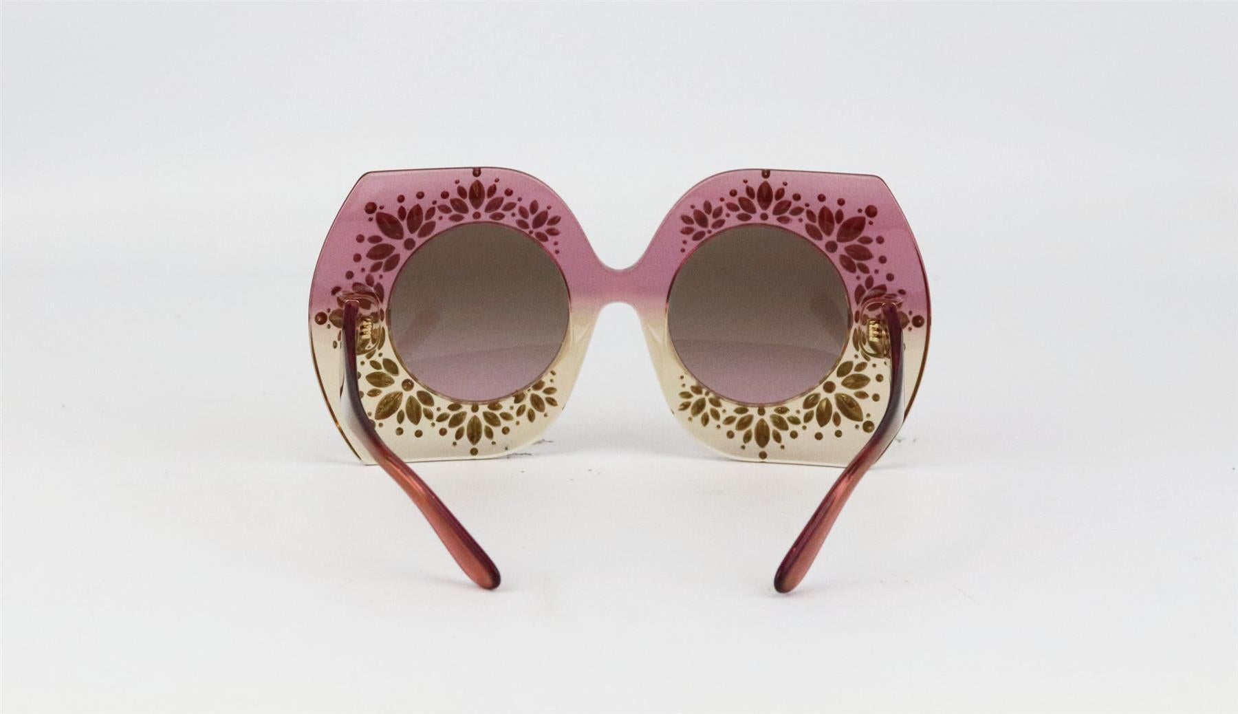 These iconic sunglasses by Dolce & Gabbana are made in Italy from glossy semi-sheer tonal-pink acetate and detail with crystal-embellishment throughout, they have an oversized square frame silhouette that is particularly flatter for your face.
