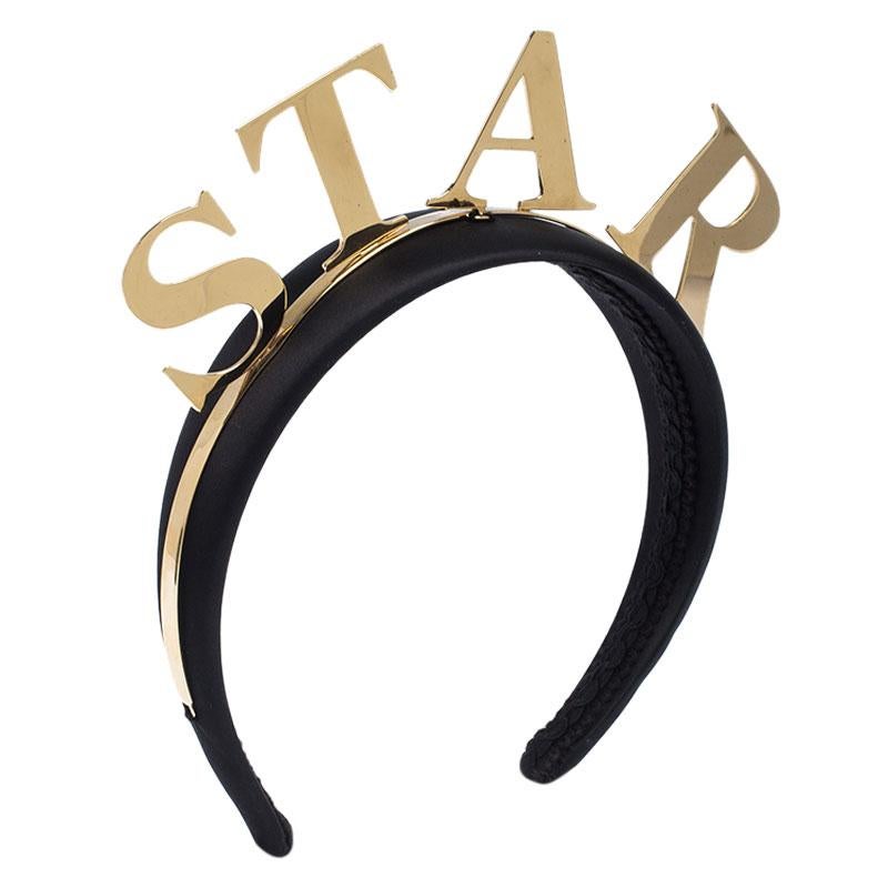This Dolce&Gabbana headband brings a fun style. It is wrapped in black satin and detailed with gold-tone metal and the word 'STAR'. So, spread style wherever you go with this cute headband.

Includes: Original Box, Price Tag


