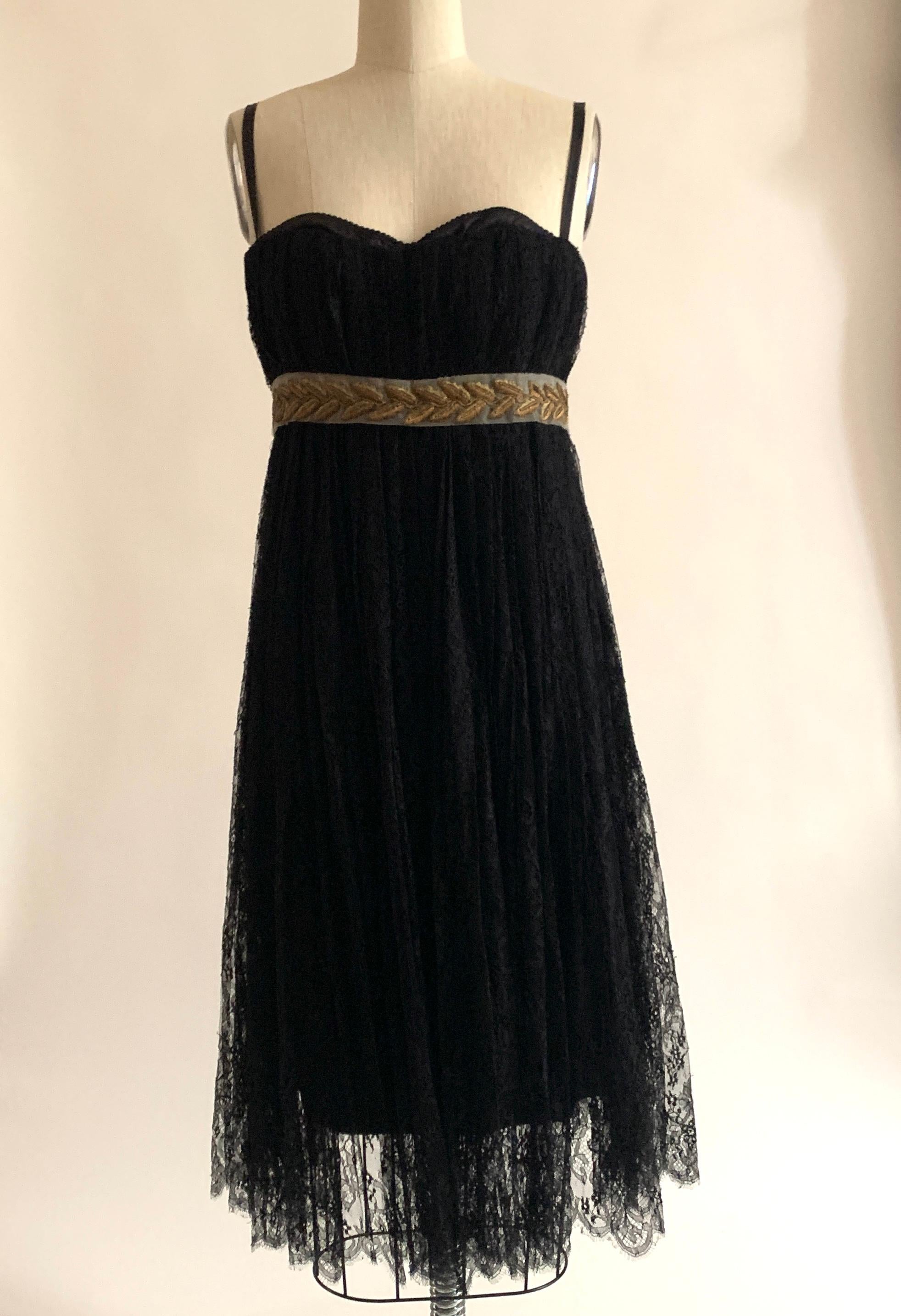 Dolce and Gabbana black lace dress with band below bust featuring gold laurel embroidery. Slightly peekaboo black built in bra (a signature D&G touch) and built in corset at top. Adjustable straps. Double back zip, one at corset and one at lining,