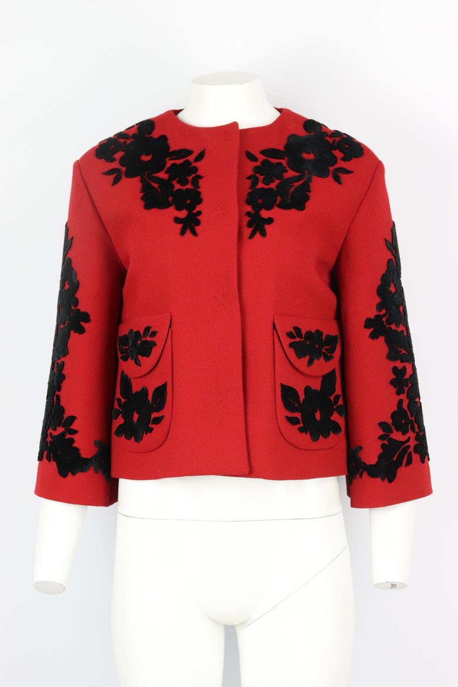 Dolce & Gabbana velvet trimmed crepe jacket. Red and black. Long sleeve, crewneck. Snap button fastening at front. 69% Wool, 20% viscose, 1% elastane; lining: 96% silk, 4% elastane. Size: IT 40 (UK 8, US 4, FR 36). Shoulder to shoulder: 17.5 in.