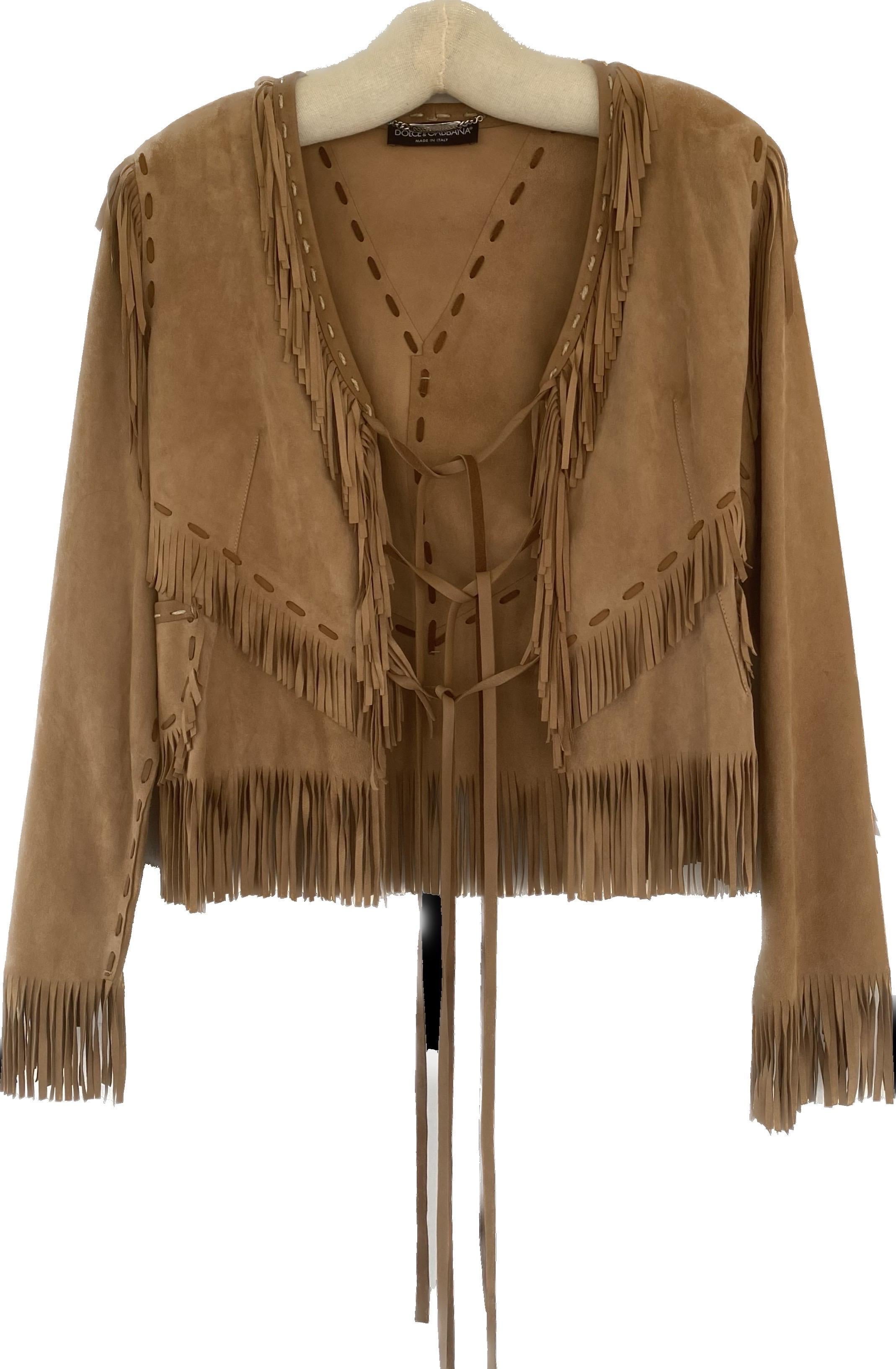 Vintage Dolce and Gabbana suede fringed suit 
Short mini skirt in a 1990s cut with long suede fringe 
Whip stitching at the waist and zipper up the back 
Jacket is also whip stitched and fastens with three long ties in the front . There are two