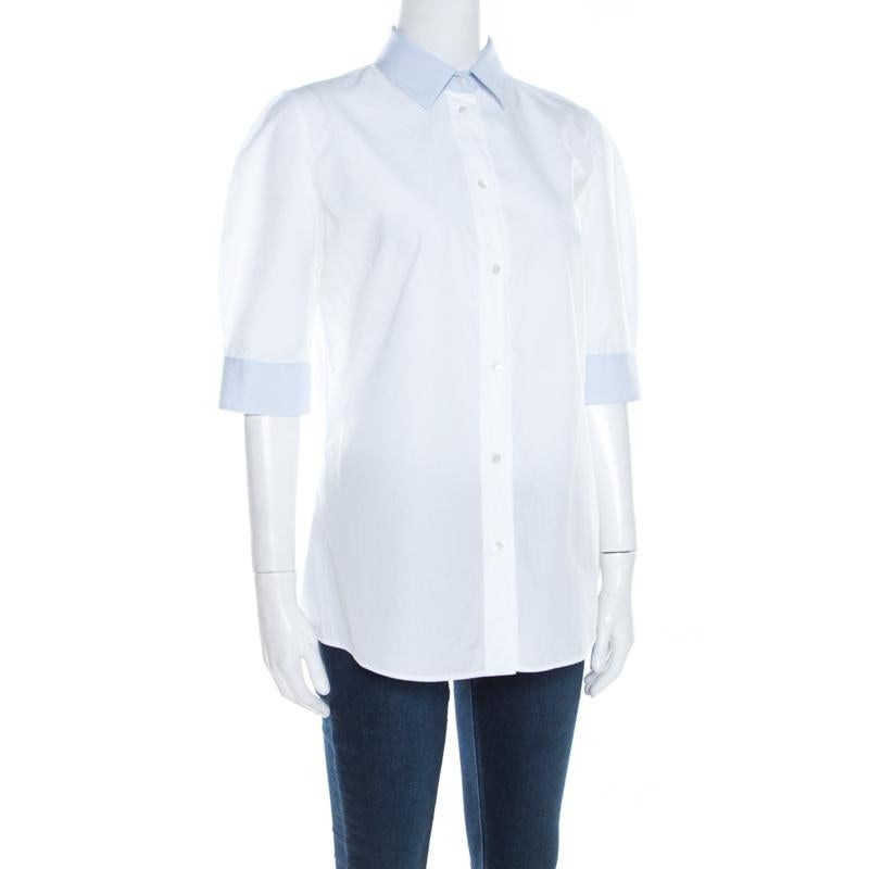 Minimal in design and style, this white shirt from Dolce & Gabbana is sure to be an amazing addition to your wardrobe! The creation is made of cotton and features a contrast collar and contrast bands on the sleeves as well as full front buttons.