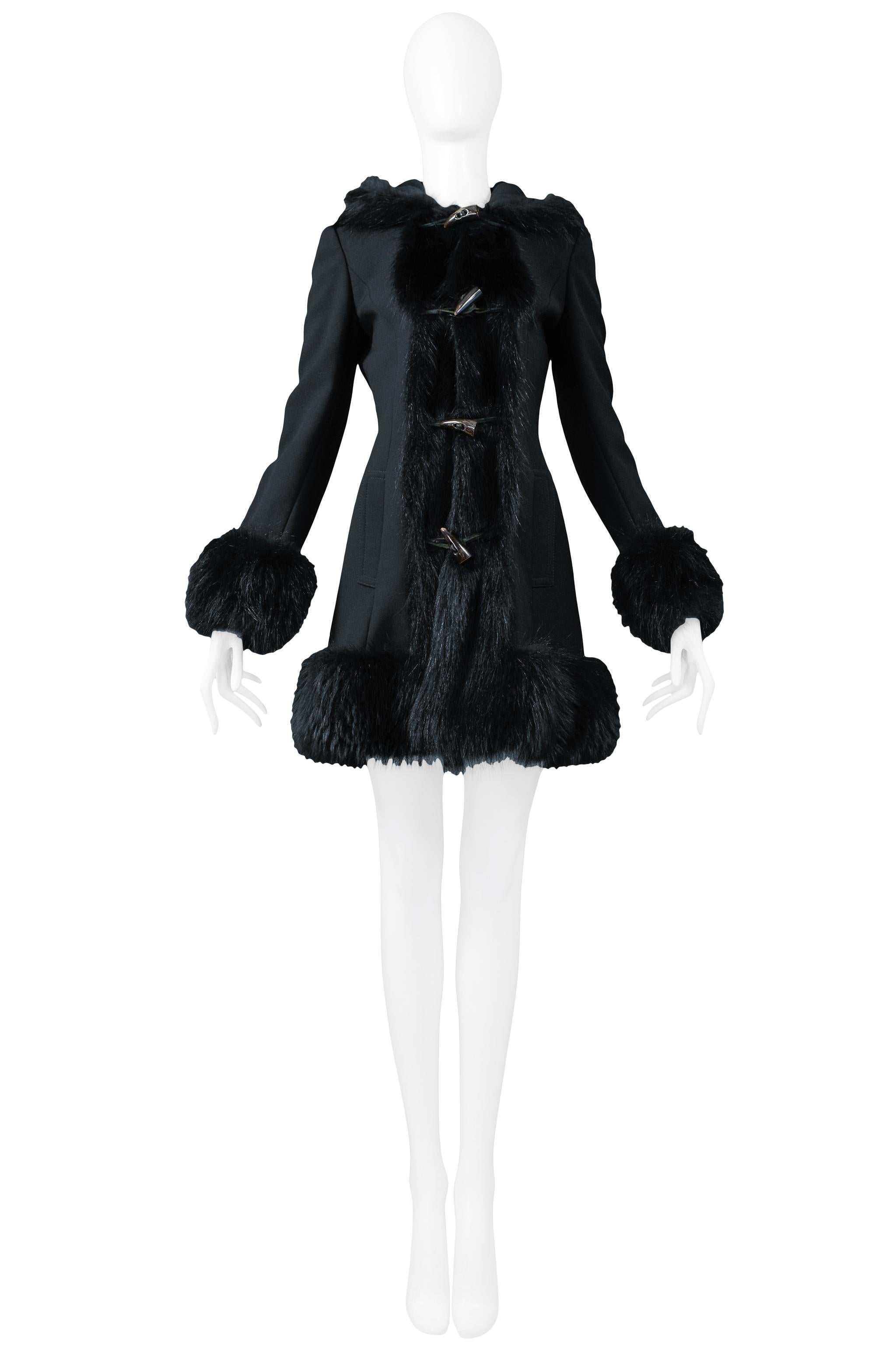 Resurrection Vintage is excited to offer a vintage Dolce & Gabbana black wool toggle coat featuring black fur cuffs, collar, and hem, a glamourous fit and flare silhouette, generous hood, and toggle and horn closure.  

Dolce & Gabbana
Size 38
Wool