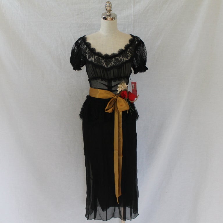 Dolce & Gabanna Black Silk and Lace Cocktail Dress - 4- NWT - Retailed for $4950. This beautiful and elegant Dolce creation is in Excellent condition, with tags and never worn. It is a timeless piece and a must have for any