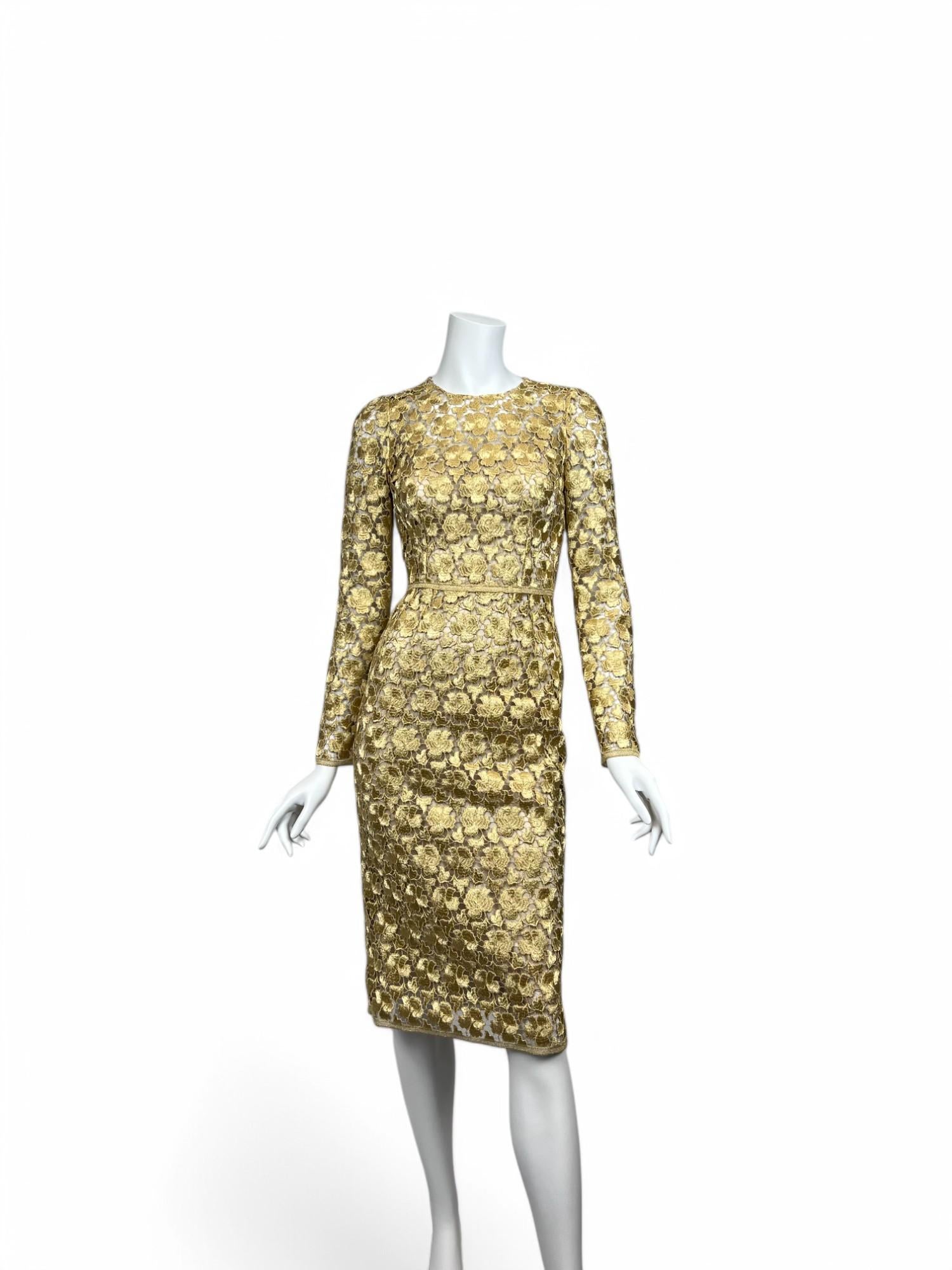 A masterpiece of intricate craftsmanship, this Dolce & Gabbana Gold Macramé Silk Dress radiates opulence and elegance. The form-fitting silhouette is adorned with delicate floral macramé lace woven from luxurious gold silk, creating a rich texture