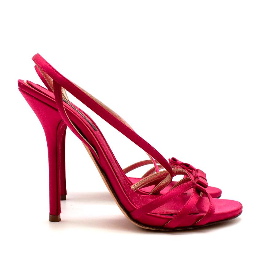 Dolce & Gabanna Pink Satin Strappy Heeled Sandals 

-Smooth silk satin texture 
-Triple strap to the toes 
-Bow detail to the front 
-Crossing ankle strap 
-Gorgeous hot pink hue 
-Classic elegant style 

Materials:
Main- satin
Lining-leather/satin