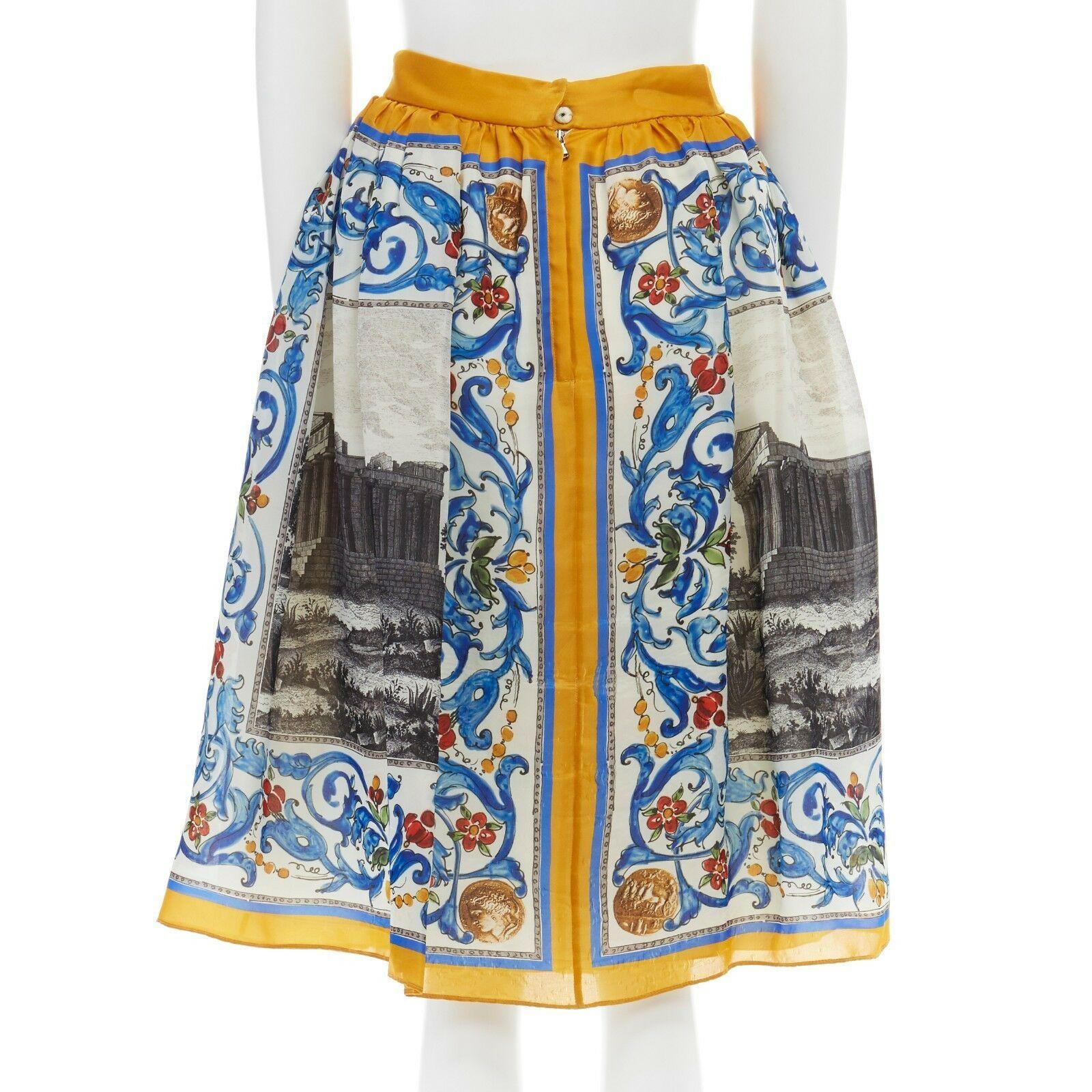 DOLCE GABBANA 100% silk blue yellow Majolica roman print flare skirt IT38 XS
DOLCE & GABBANA
100% silk. Yellow and blue Majolica print. Roman coin and architecture print. Flat waistband. Pleated at waist. Concealed button and zip back closure. Fully
