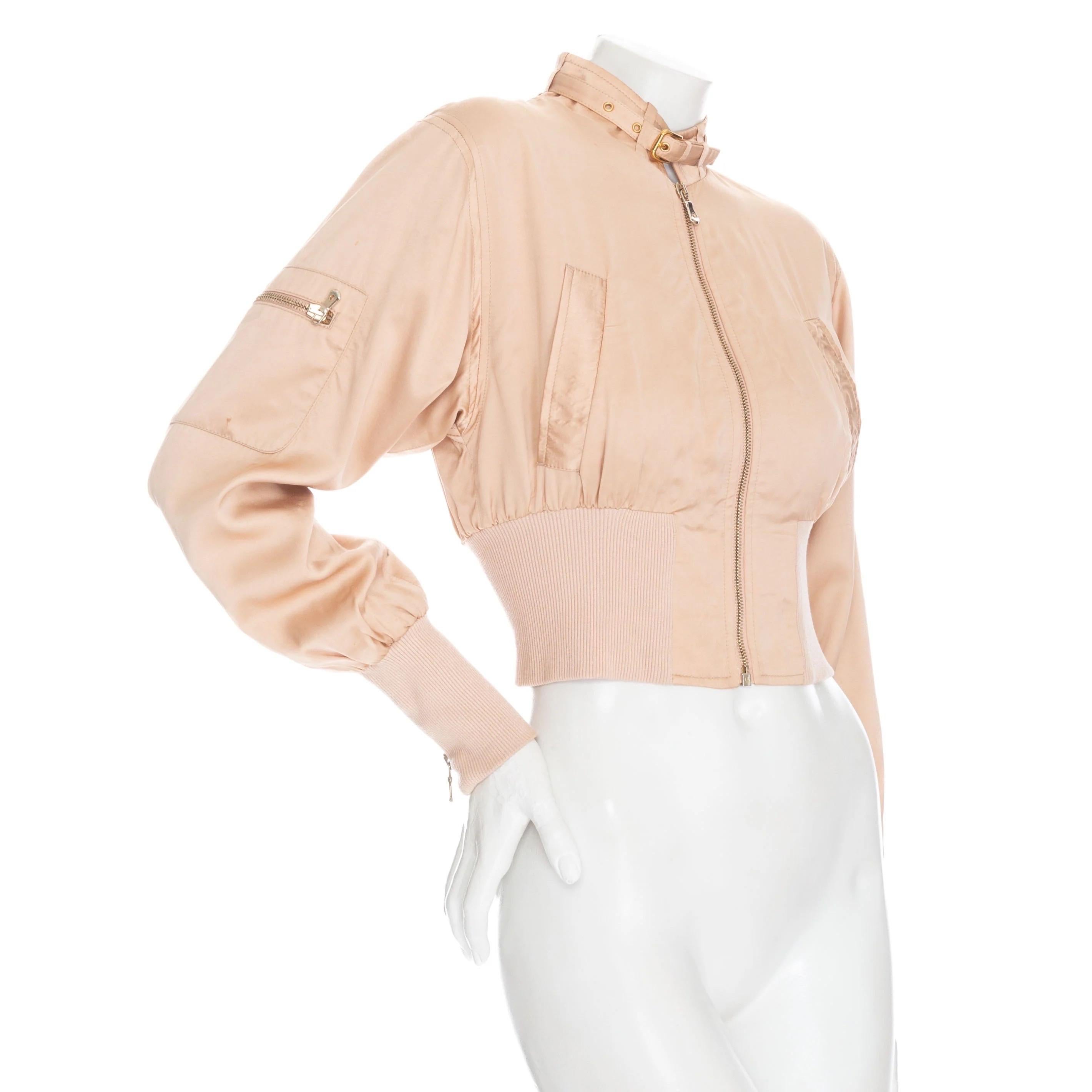 Dolce & Gabbana 1990s Blush Zip Crop Bomber Jacket

Vintage; circa 1990s
Blush / Beige / Neutral
Gold-tone hardware
Long sleeves
Ribbed trim on cuffs and waistband
Banded collar with belt
Side pockets
Utility-inspired zipped patch pocket on