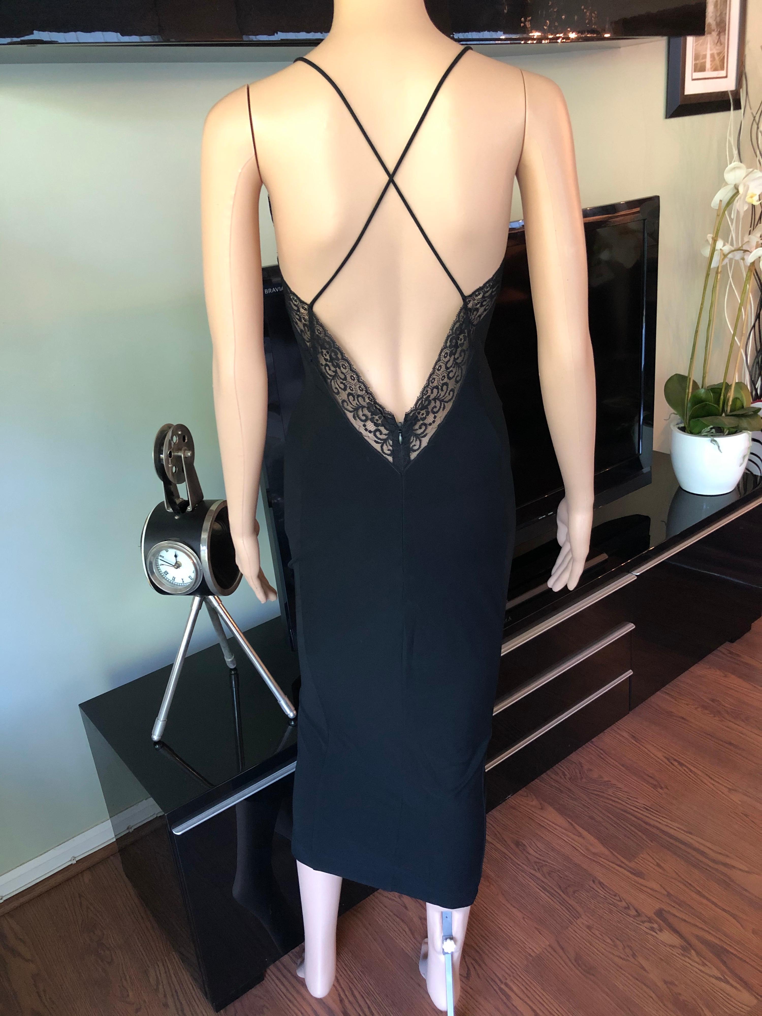 Dolce & Gabbana 1990's Vintage Plunging Neckline Open Back Lace Black Dress IT 40

Dolce & Gabbana lace trimmed fitted dress with plunging V-neck, low back and narrow straps. Please note size tag has been removed.
