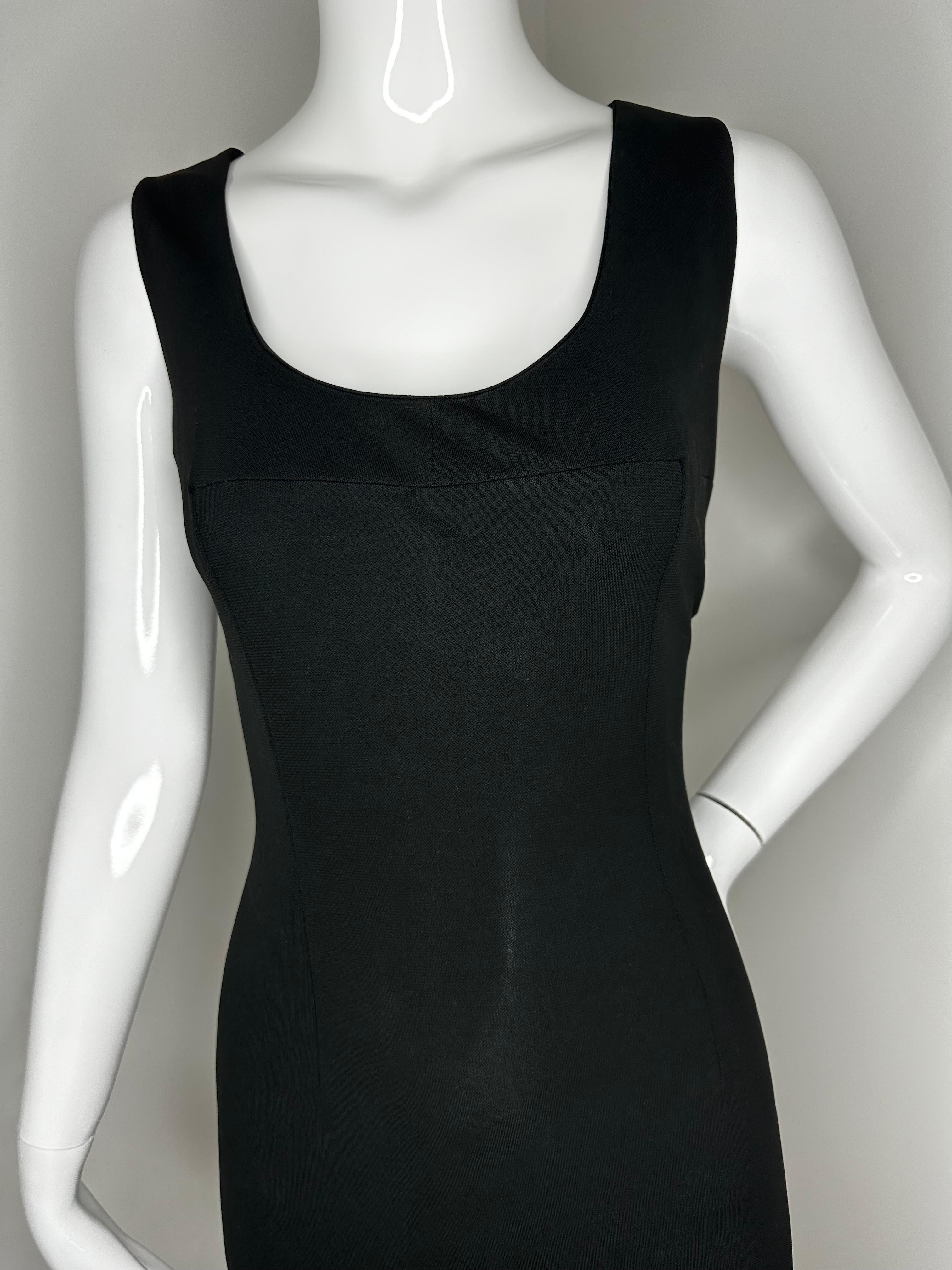 Dolce Gabbana S/S 1996 runway black mini dress with slits 

One side has a deeper slit than the other 
Stretchy, soft fabric 
Size 42 
Total length approx. 34 inches 

Good vintage condition, no rips or stains 
Normal overall wear consistent with age