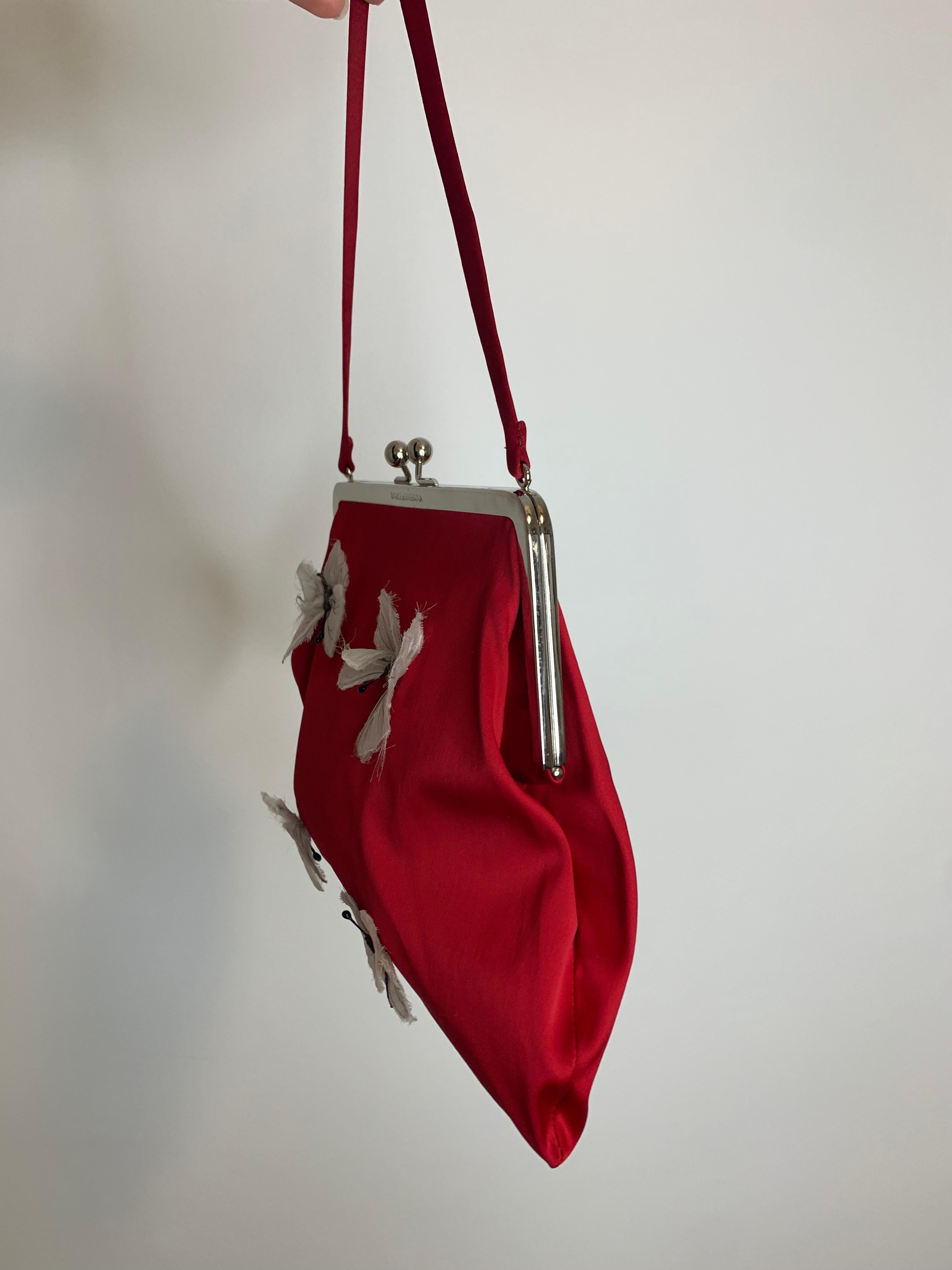 Iconic and rare Dolce Gabbana red butterfly embellished bag from 1998 “Stromboli” collection 

Good vintage condition. Two tiny holes in the back (from a pin). See photos 
