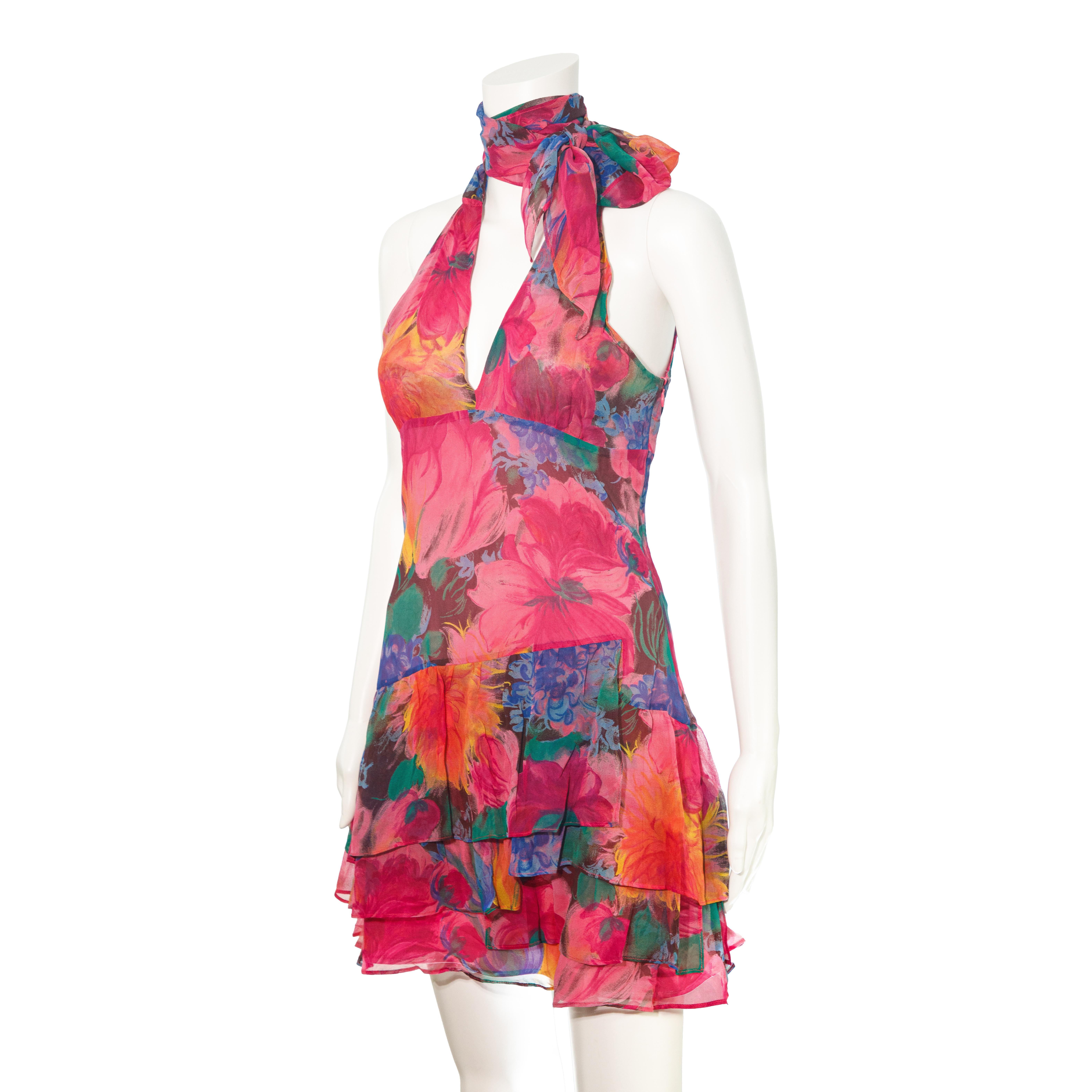 Ruder Than The Rest presents a 2000s era D&G line silk mini dress.

Abstract flower print that uses a beautiful colour palette.

Neck wrap around tie comes completely undone, can be tied however you want it to be.

Layered ruffle skirt. 

Not sheer