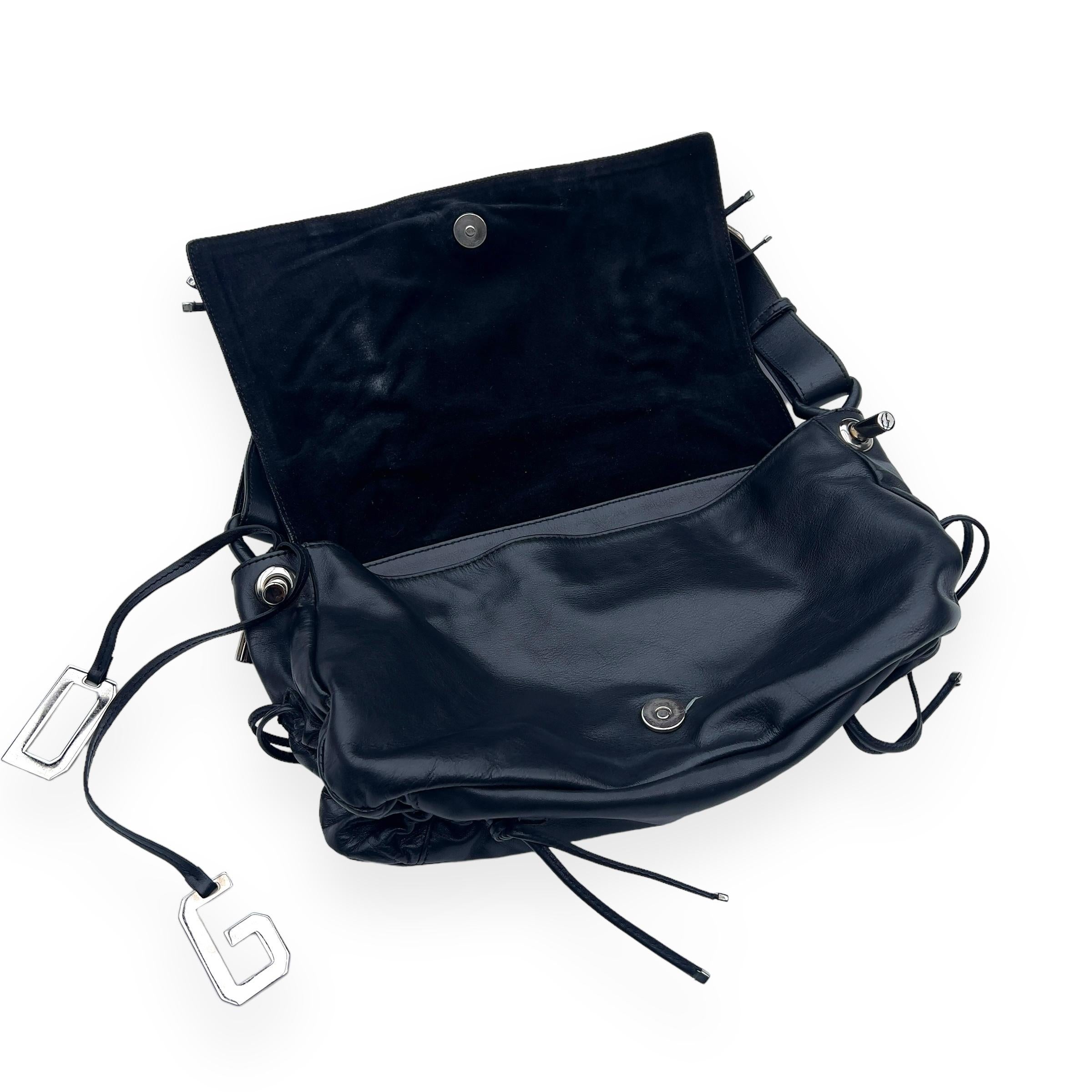 Vintage leather Dolce & Gabbana c. 2003F/W bag. 

Dolce & Gabbana, the iconic Italian fashion house founded by Domenico Dolce and Stefano Gabbana, made a significant impact on 2000s fashion with their bold and glamorous designs. Known for their
