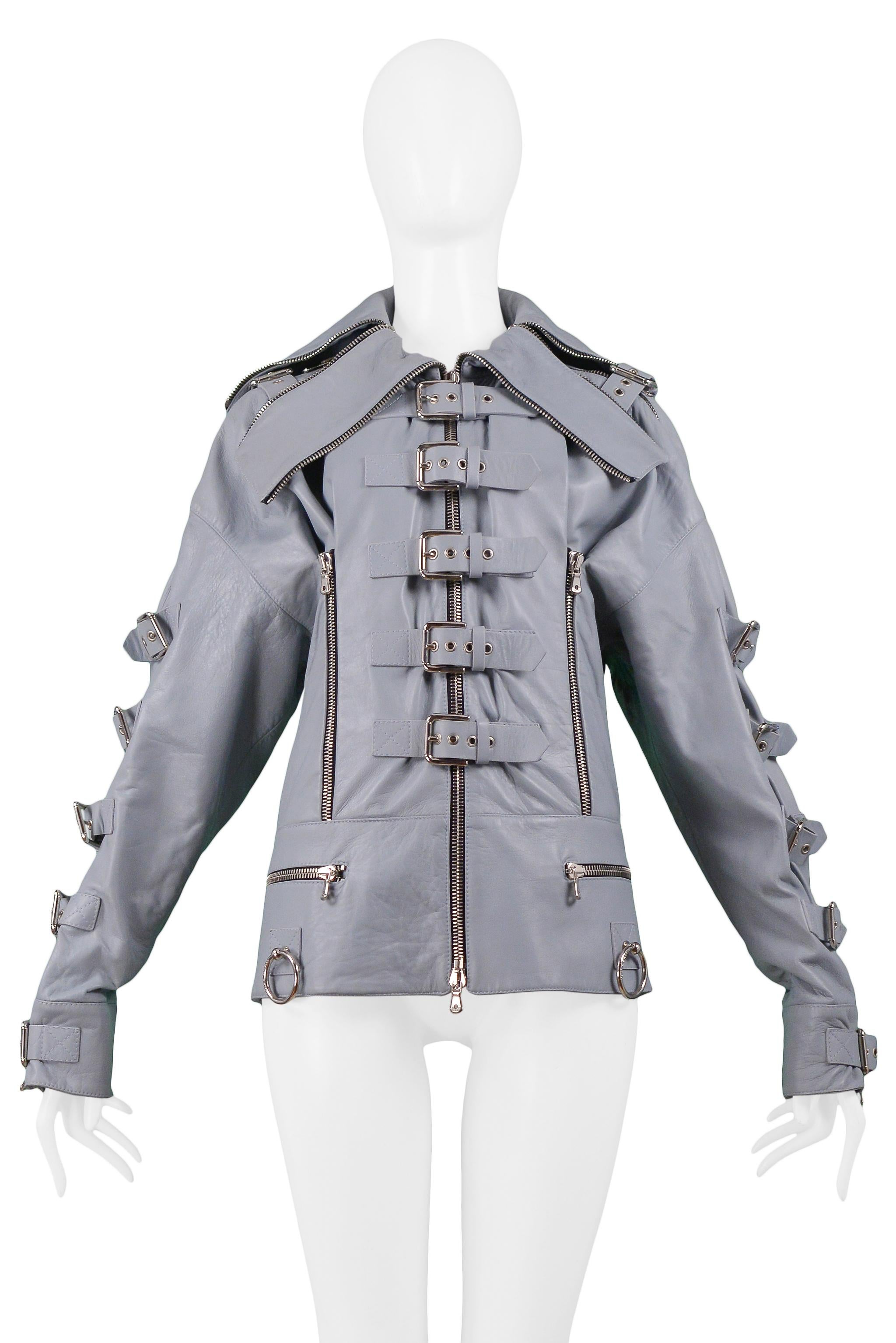 Resurrection Vintage is excited to offer a vintage Dolce & Gabbana grey lambskin leather biker jacket from the 2003 runway collection. The jacket features a large collar, long sleeves, and center front zip closure. The jacket is embellished with