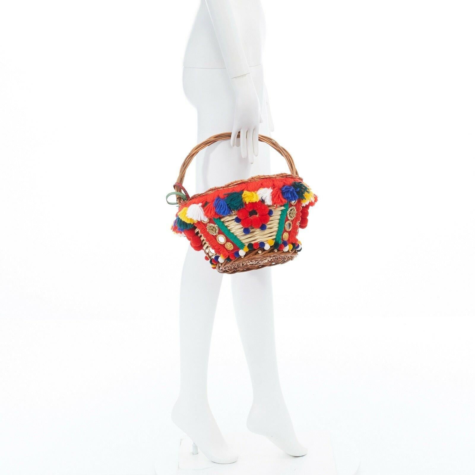 DOLCE GABBANA 2016 red pom pom embellished wicker basket pouch bag
Reference: LNKO/A00793 
Brand: Dolce Gabbana 
Designer: Domenico Dolce and Stefano Gabbana 
Collection: Spring Summer 2016 Runway 
Material: Wicker 
Color: Multicolour 
Pattern: