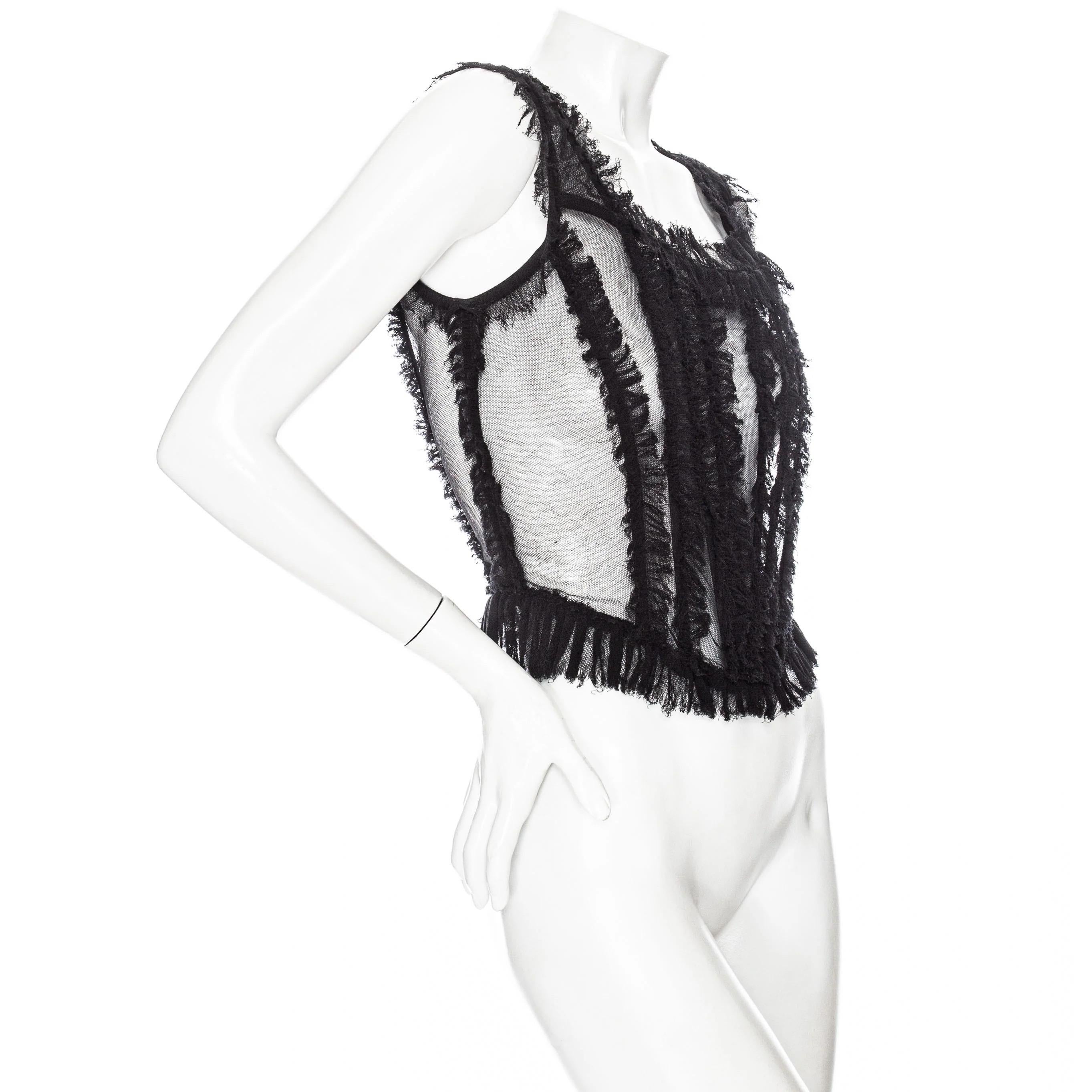 Dolce & Gabbana 2017 Black Stretch Tulle Ruffled Bustier Top 

Fall 2017 Ready-to-Wear
Black
Semi sheer mesh panels
Interior boning
Sleeveless
Wide straps
Raw ruffled trim
Scoop neckline
Exposed silver-tone zip closure at back
Made in Italy
49%