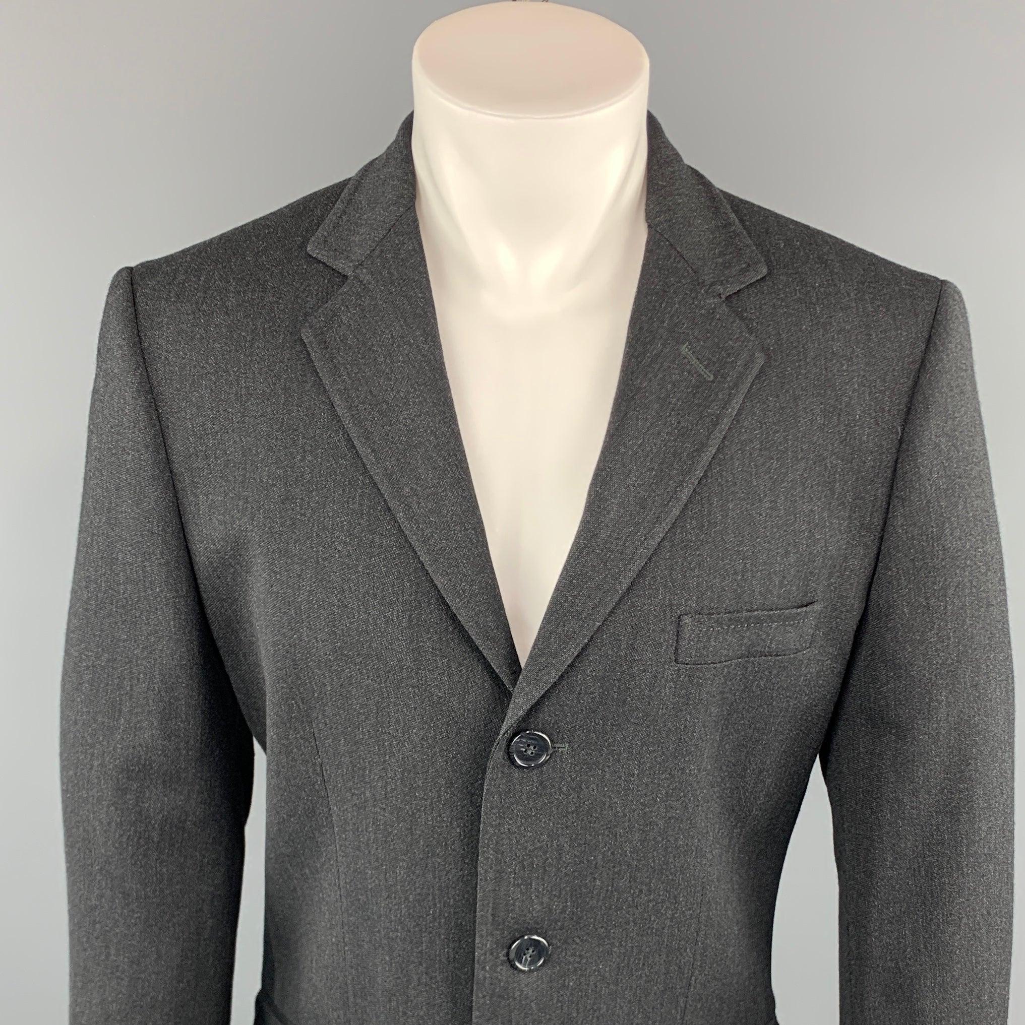 DOLCE & GABBANA sport coat comes in a charcoal wool blend featuring a notch lapel, flap pockets, and a three button closure. Made in Italy.
Excellent
Pre-Owned Condition. 

Marked:   IT 50 

Measurements: 
 
Shoulder: 18 inches 
Chest: 40 inches