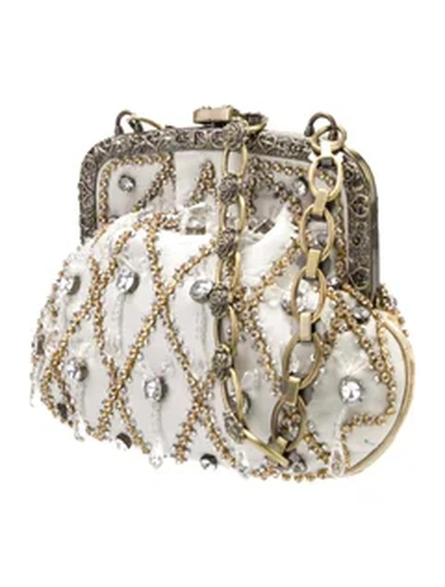 Dolce & Gabbana Alta Moda Ivory Beaded Evening Minaudière with Antique Gold Hardware

A stunning example of Dolce & Gabbana’s opulent design aesthetic, this minaudière clutch is a showstopping piece made for glamorous evenings. Crafted from ivory