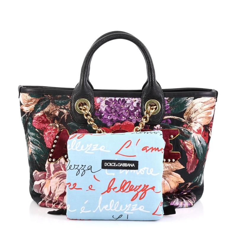 This Dolce & Gabbana Amore Shopping Tote Jacquard Medium, crafted from multicolor jacquard, features dual rolled leather handles, dual chain link straps, and gold-tone hardware. Its magnetic snap closure opens to a black fabric interior with slip