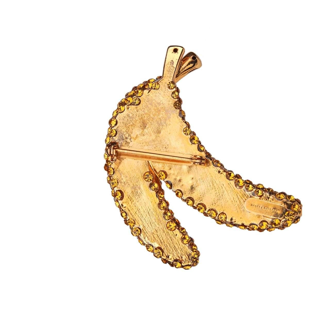 - Banana Brooch with crystals in yellow and gold by DOLCE & GABBANA - RUNWAY - Dolce & Gabbana Fashion Show - Former RRP: EUR 435 - New with Tag - MADE IN ITALY - Yellow crystals - Nickel free - Model: WPJ2F9-W0001-ZOO00 - Material: 60% Brass, 40%