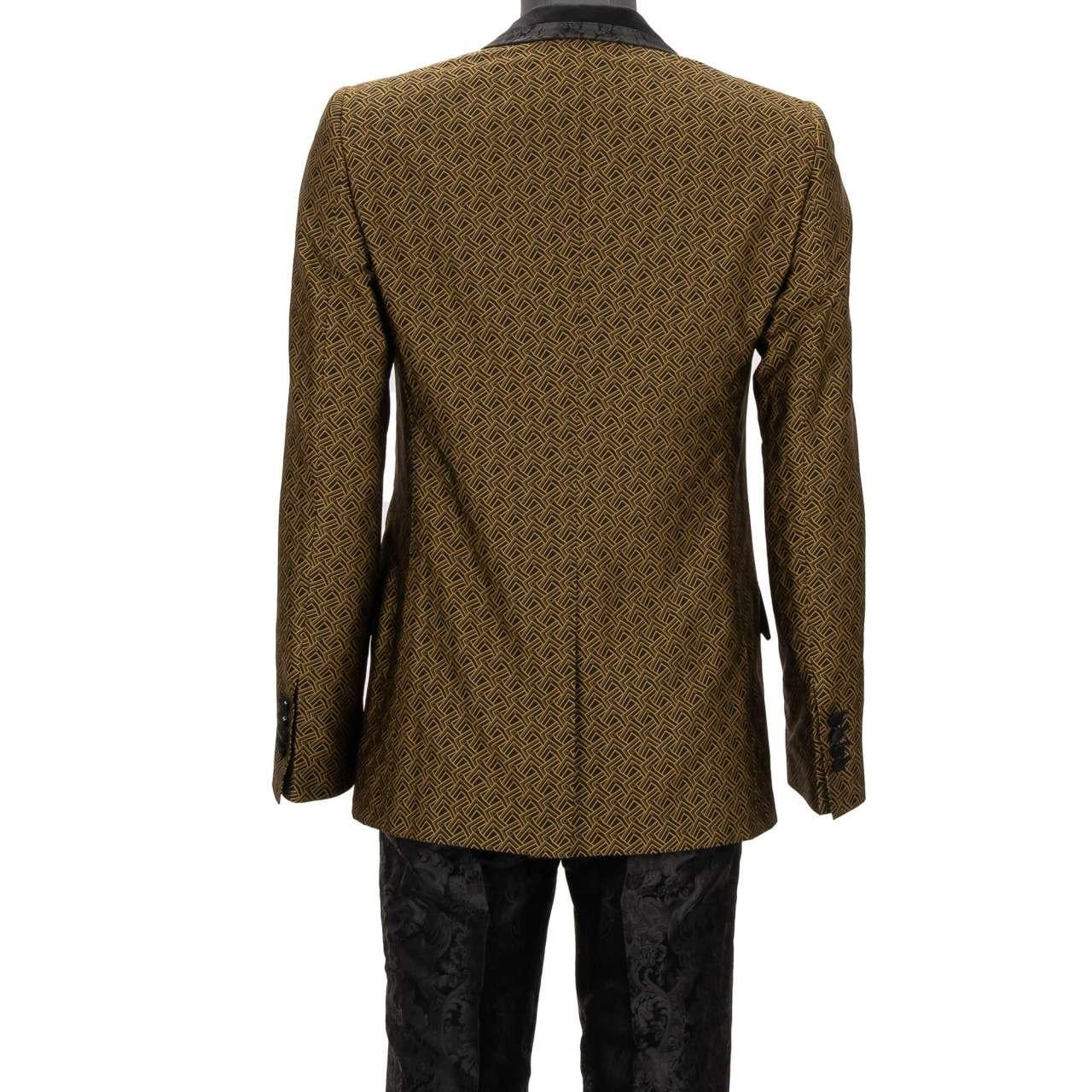 - Baroque jacquard double-breasted suit with geometric and floral pattern peak lapel in black and gold by DOLCE & GABBANA - SICILIA Model - RUNWAY - Dolce & Gabbana Fashion Show - New with tag - MADE in ITALY - Slim Fit - Model: GKH8MT-HJMFR-S8350 -
