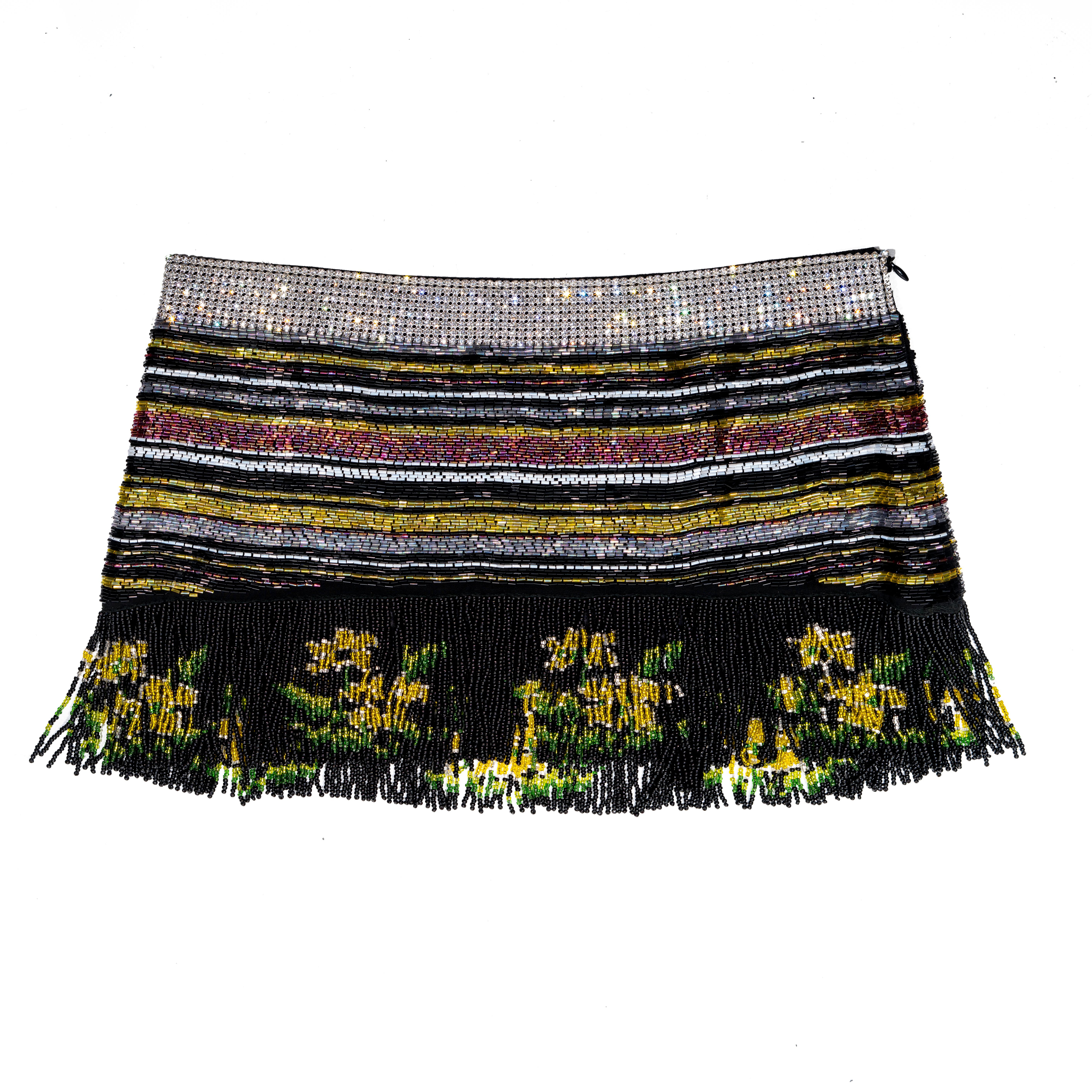 ▪ Dolce & Gabbana beaded mini skirt 
▪ Multicolour horizontally beaded stripes 
▪ Crystal mesh waistband 
▪ Beaded tassel trim with floral pattern 
▪ Low-rise
▪ Silk lining 
▪ IT 42 - FR 38 - UK 10 - US 6
▪ Spring-Summer 2000
▪ 100% Silk
▪ Made in