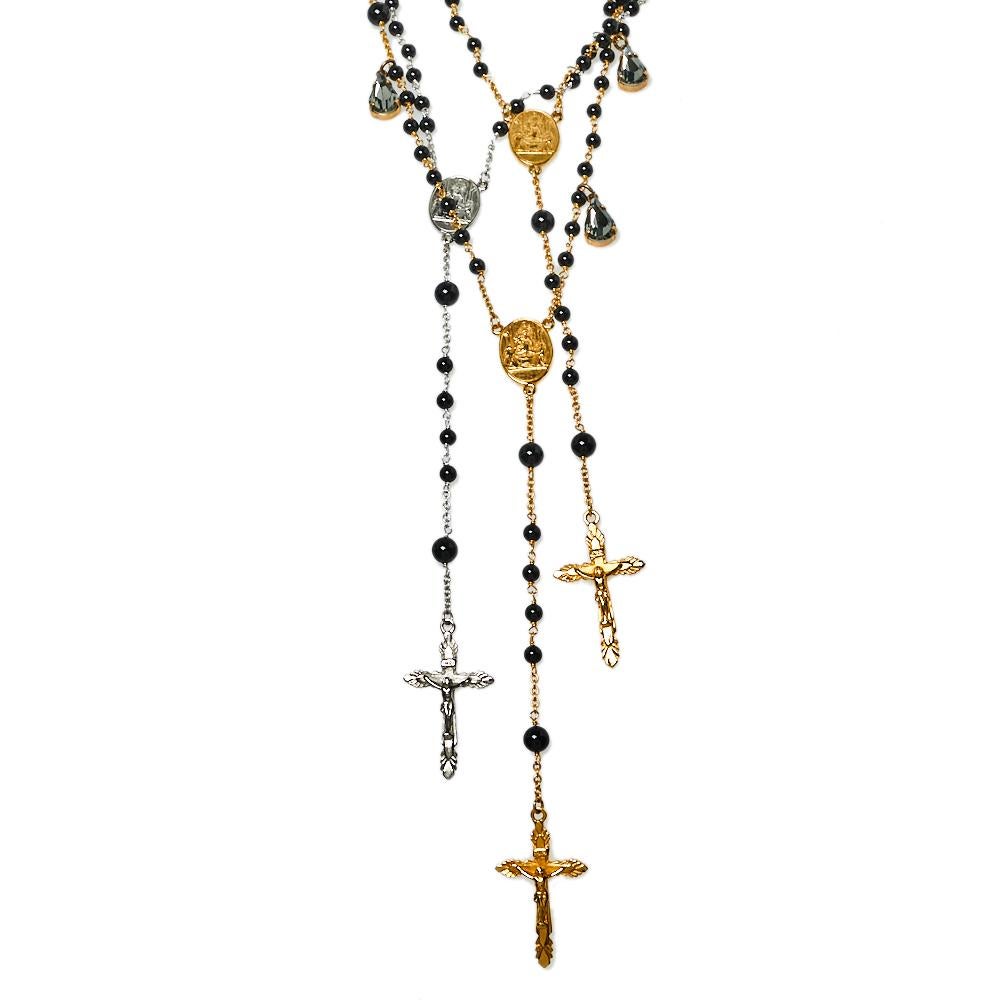This Rosary necklace by Dolce & Gabbana is designed in a layered style using two-tone metal. The necklace has a gathering of beads, metal charms, and cross symbols. It arrives in its original box.

