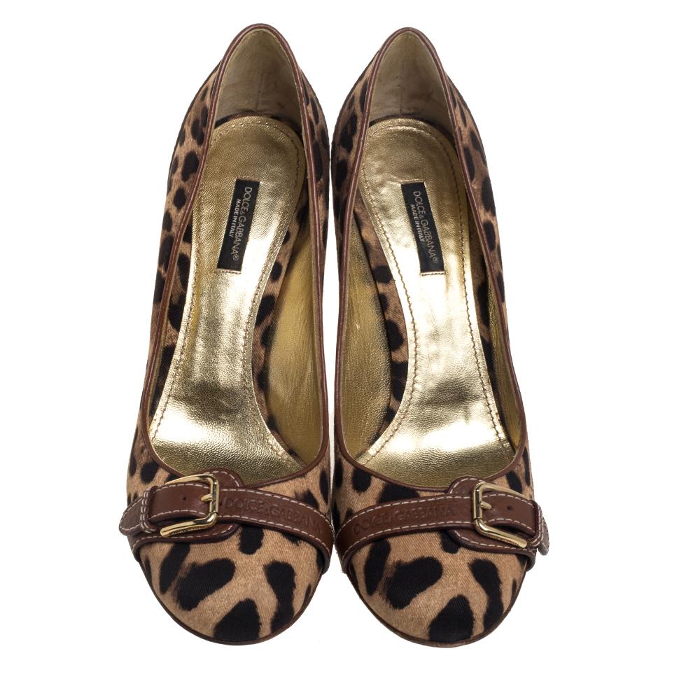 Crafted with canvas and leather, these animal-printed pumps by Dolce & Gabbana are a classic design for your shoe collection. A much-loved pattern from the brand, animal prints are a timeless style element every closet must have. This pair is lined