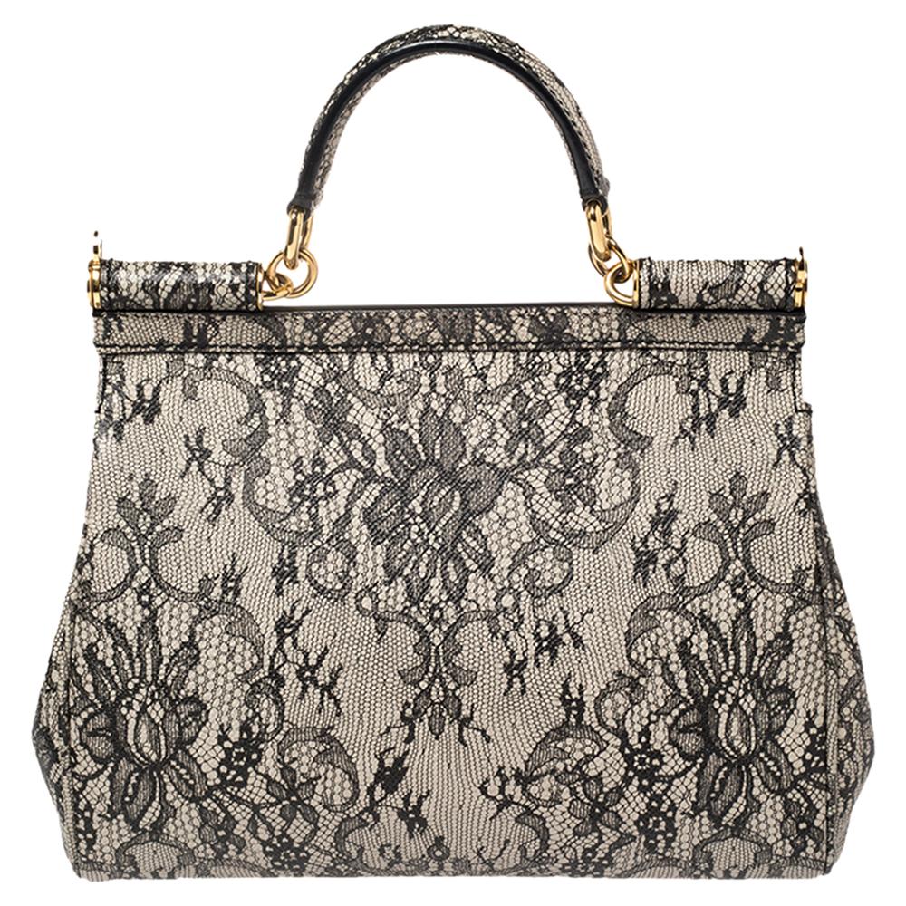 The coveted Miss Sicily bag by Dolce & Gabbana has been presented in a variety of versions, beautified with many elements while keeping the iconic silhouette intact. We have here an elegant version of the icon. Crafted using leather, the bag is