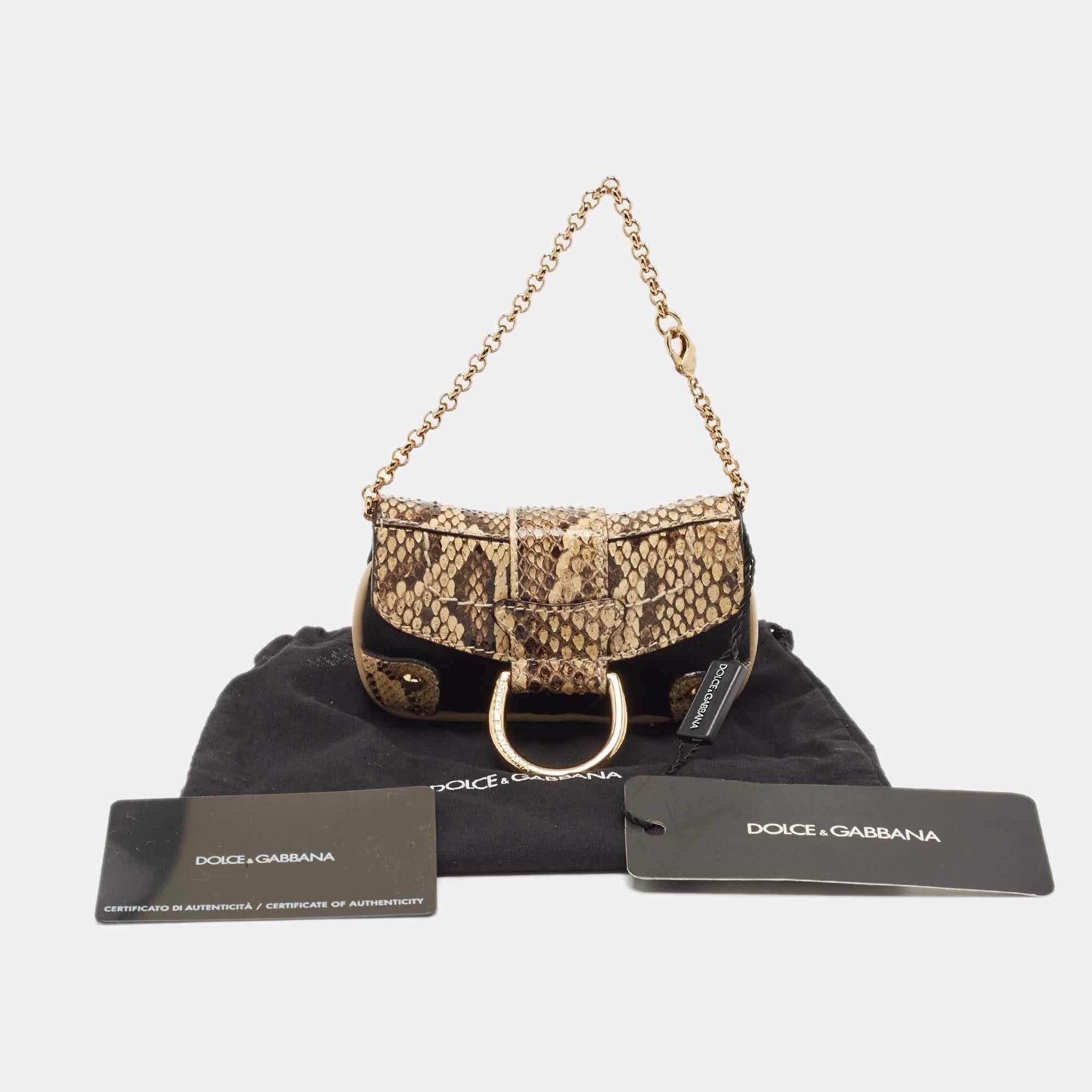 Designed by Dolce & Gabbana, this coin purse made from python leather is the perfect accessory to keep your coins in proper order, as it features multiple slots.

