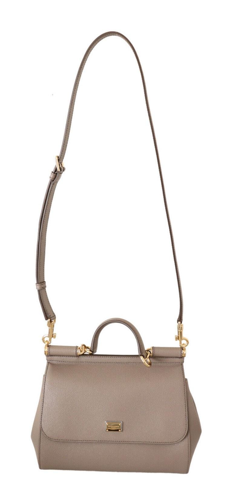 DOLCE & GABBANA

Gorgeous brand new with tags, 100% Authentic Dolce & Gabbana Women's Bag.

Model: SICILY

Material: Leather

Color: Beige with gold metal detailing

Strap: One handle, one detachable and adjustable shoulder strap

Magnetic flap