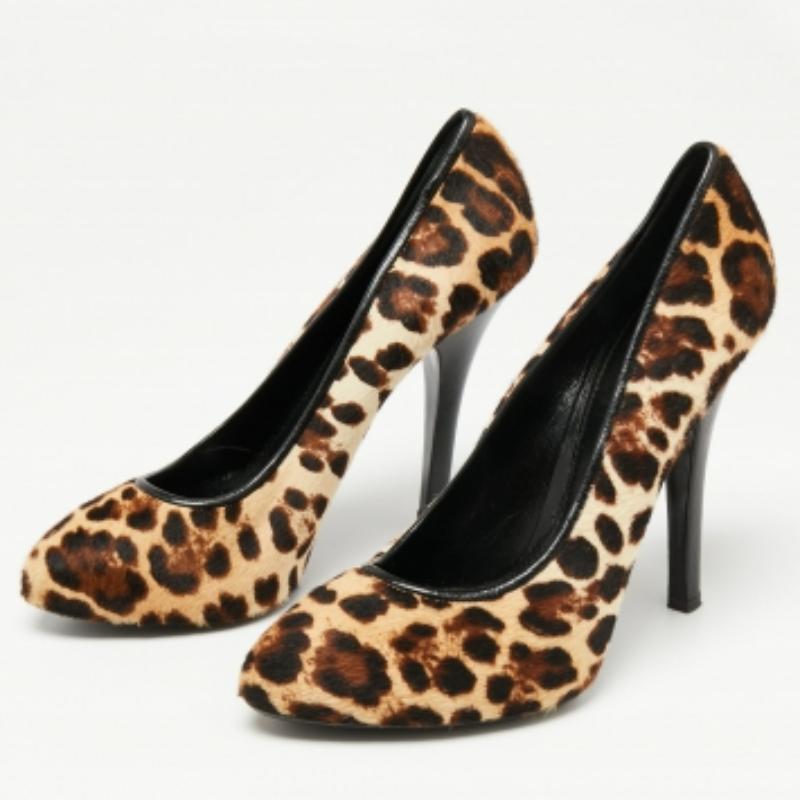 This pair of pumps designed by Dolce & Gabbana is exactly what you want. Crafted from pony hair, the leopard-printed exterior and high stiletto heels offer a high-fashion look. They have comfortable insoles and almond toes. Add a touch of bold style
