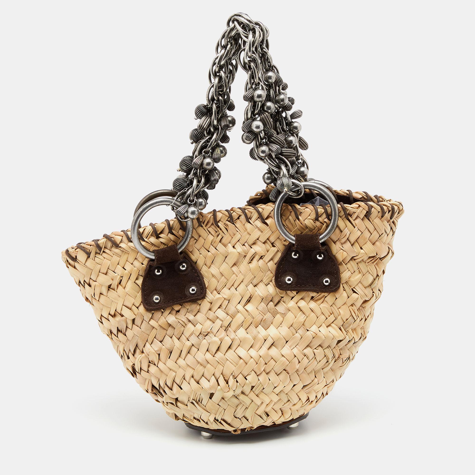 If you get this Dolce & Gabbana bag, you'll be carrying the cutest bag this season. Made from straw and suede in a mini size, the bag is elevated with chain handles for an eye-catching finish.

