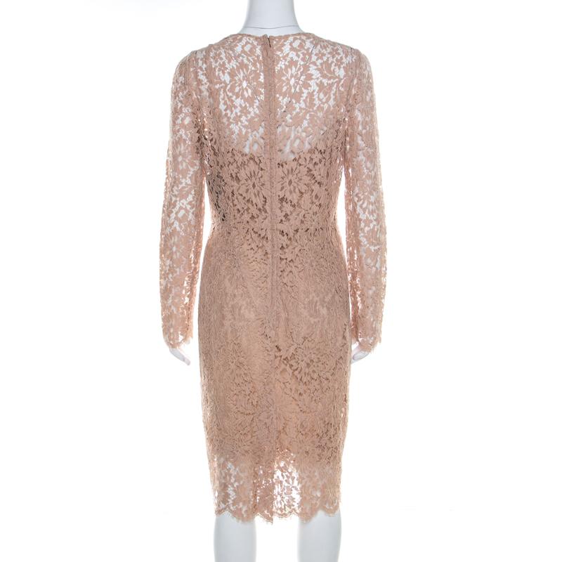 Make room in your closet for this graceful creation from the house of Dolce&Gabbana. Designed for a subtle look, this beige sheath dress is fabulous for a formal event. This dress features lace overlay, full sleeves and a back