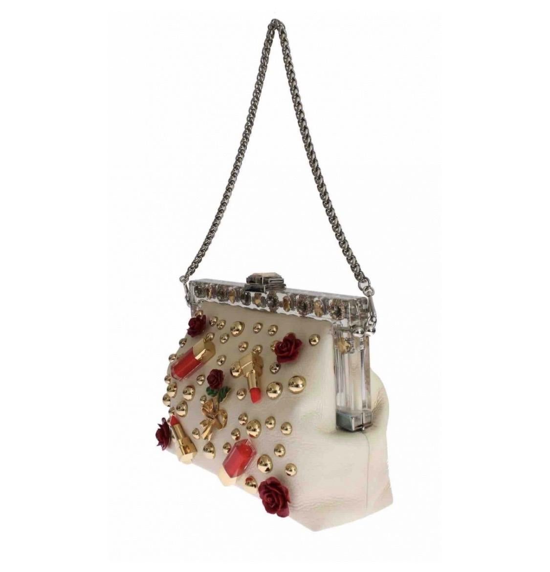 Authentic Dolce & Gabbana in lipstick crystal beige leather and roses adorned with an evening handbag VANDA shoulder clutch. Model: VANDA bag Material: 100% leather Color: beige with metal details silver and gold Crystal: transparent and champagne