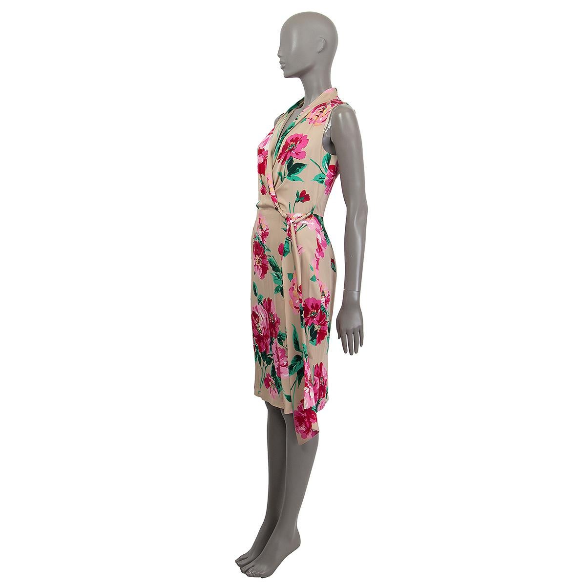 100% authentic Dolce & Gabbana sleeves wrap dress in beige silk (with 6% elastane) with pink and greeen floral print. Opens with a zipper in the back. Lined in silk (with 4% elastane). Has been worn and is in excellent condition.

Measurements
Tag