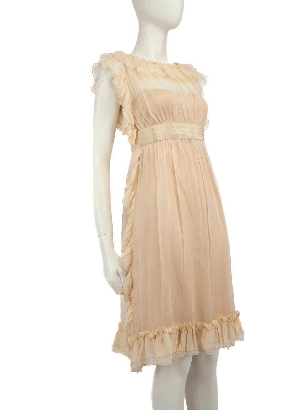 CONDITION is Very good. Minimal wear to the dress is evident. There is a pull to the weave on the ruffle trimming on the right sleeve. The thread on the back off the waistband of the dress is slightly fraying and the composition label is missing on