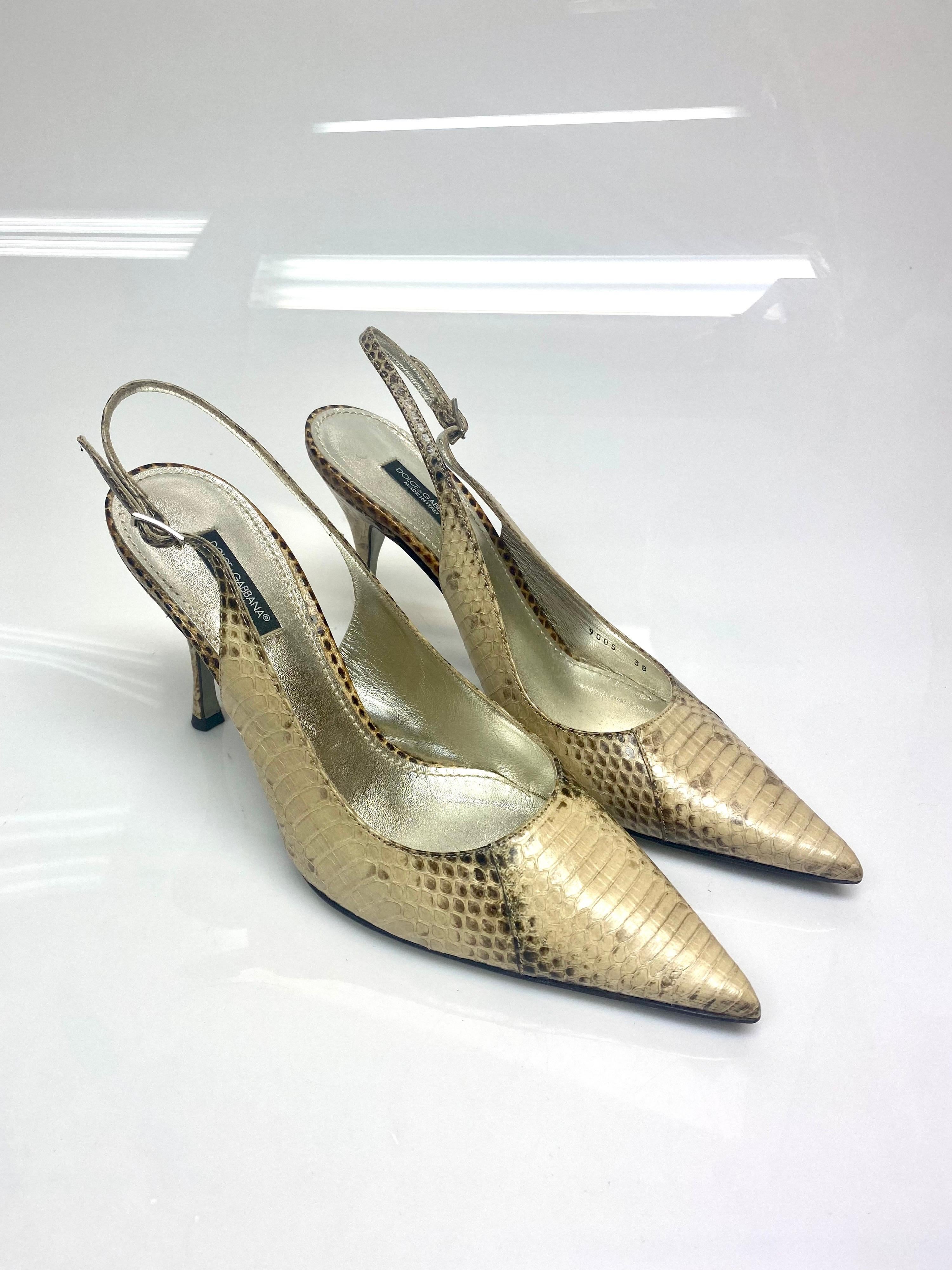 Dolce & Gabbana Beige Snake Slingback Heels Size 38. These beautiful creations by Dolce & Gabbana are a stunning pair to add to any closet. Featuring a pointed toe and slingback style shoe for that touch of sophistication. Item is in excellent