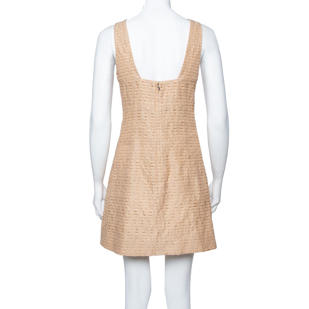 This dress from Dolce & Gabbana will be your go-to option for any event that you have to attend. Look elegant and polished with this beige dress, and you are all set to look like a diva. Made in textured cotton, this dress lends an air of