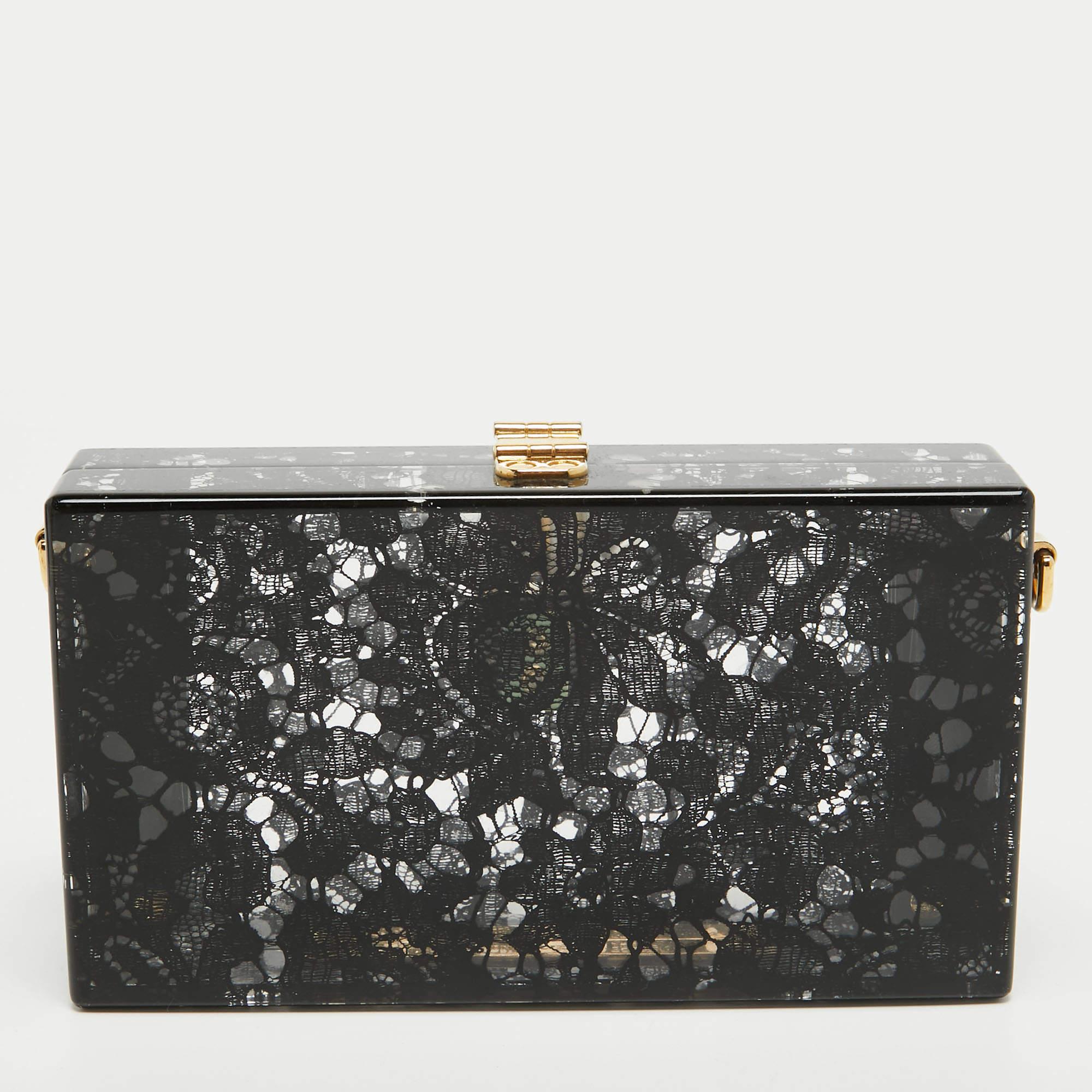 Elevate your evening attire with our Dolce & Gabbana clutch for women. Crafted with exquisite detail, it combines luxurious materials, a timeless design, and a touch of glamour, making it the perfect statement accessory.

