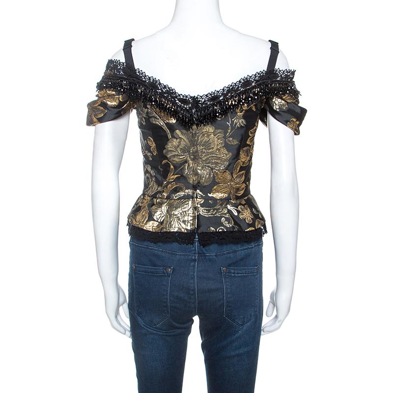 Get this stunning top from Dolce & Gabbana now! Crafted from exquisite gold and black jacquard fabric, this corset top is a must-have. It features an off-shoulder silhouette and comes with lace trimming on the top and hem, a slight peplum, and