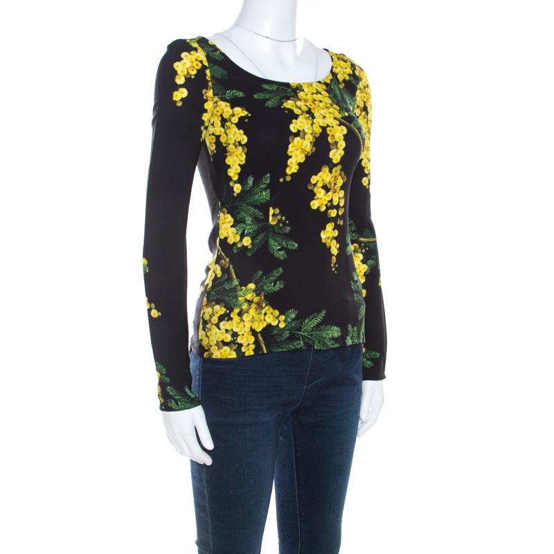 This one is an awesome piece from the house of Dolce and Gabbana. Fabulously crafted, this gorgeous top is adorned with a floral Acacia print that looks accentuating on the black base. Channel a fun, feminine vibe by styling it with a solid colored