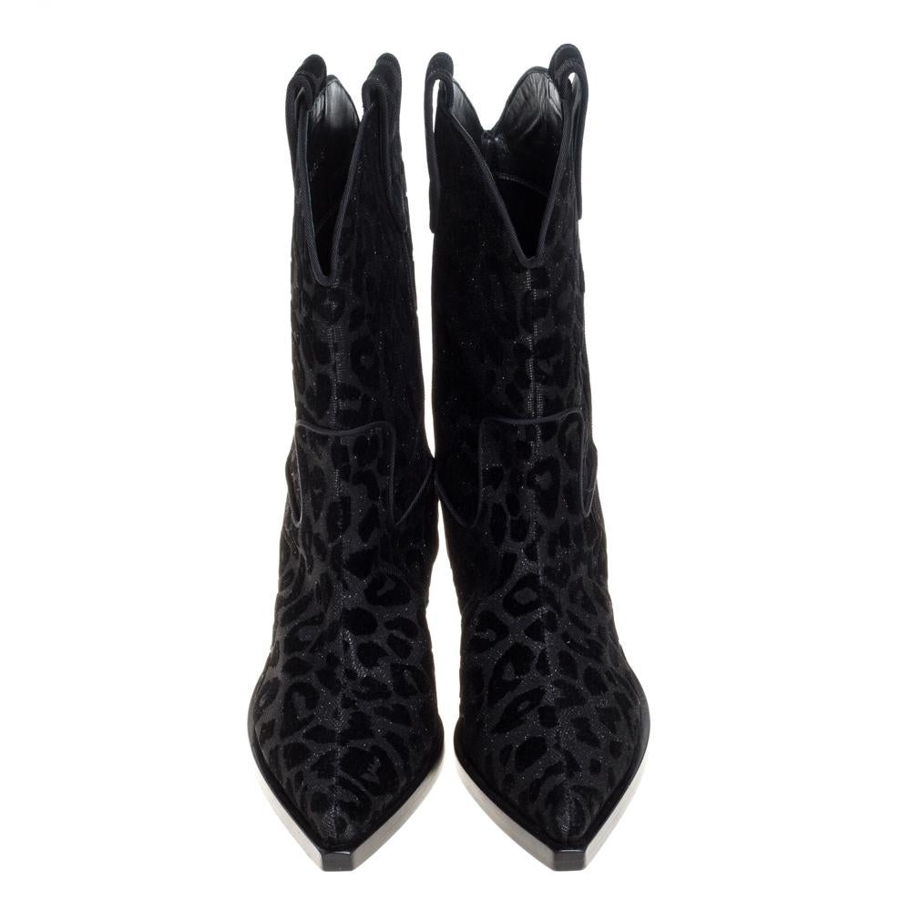 Known for its finesse and impeccable artistry, Dolce & Gabbana again surprises us with these stylish cowboy boots. Crafted from shimmering leopard-printed fabric and velvet, the boots feature pointed toes and are lined with leather. Small heels