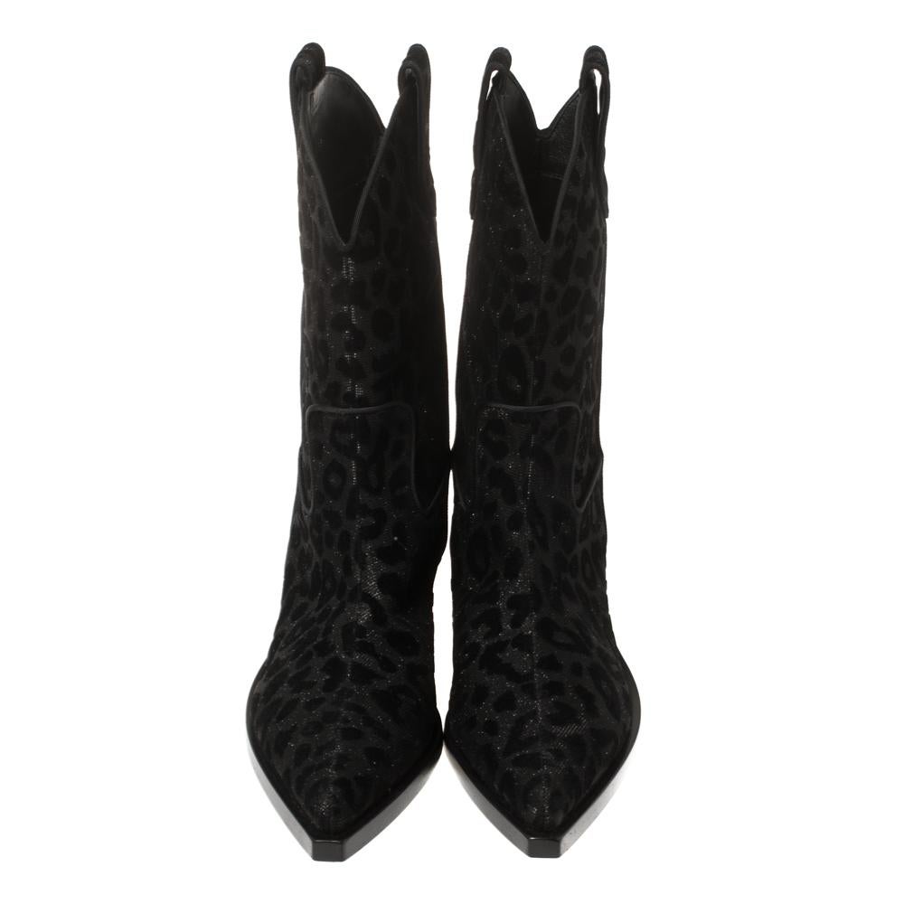 Known for its finesse and impeccable artistry, Dolce & Gabbana again surprises us with these stylish cowboy boots. Crafted from shimmering leopard-printed fabric and velvet, the boots feature pointed toes and are lined with leather. Small heels