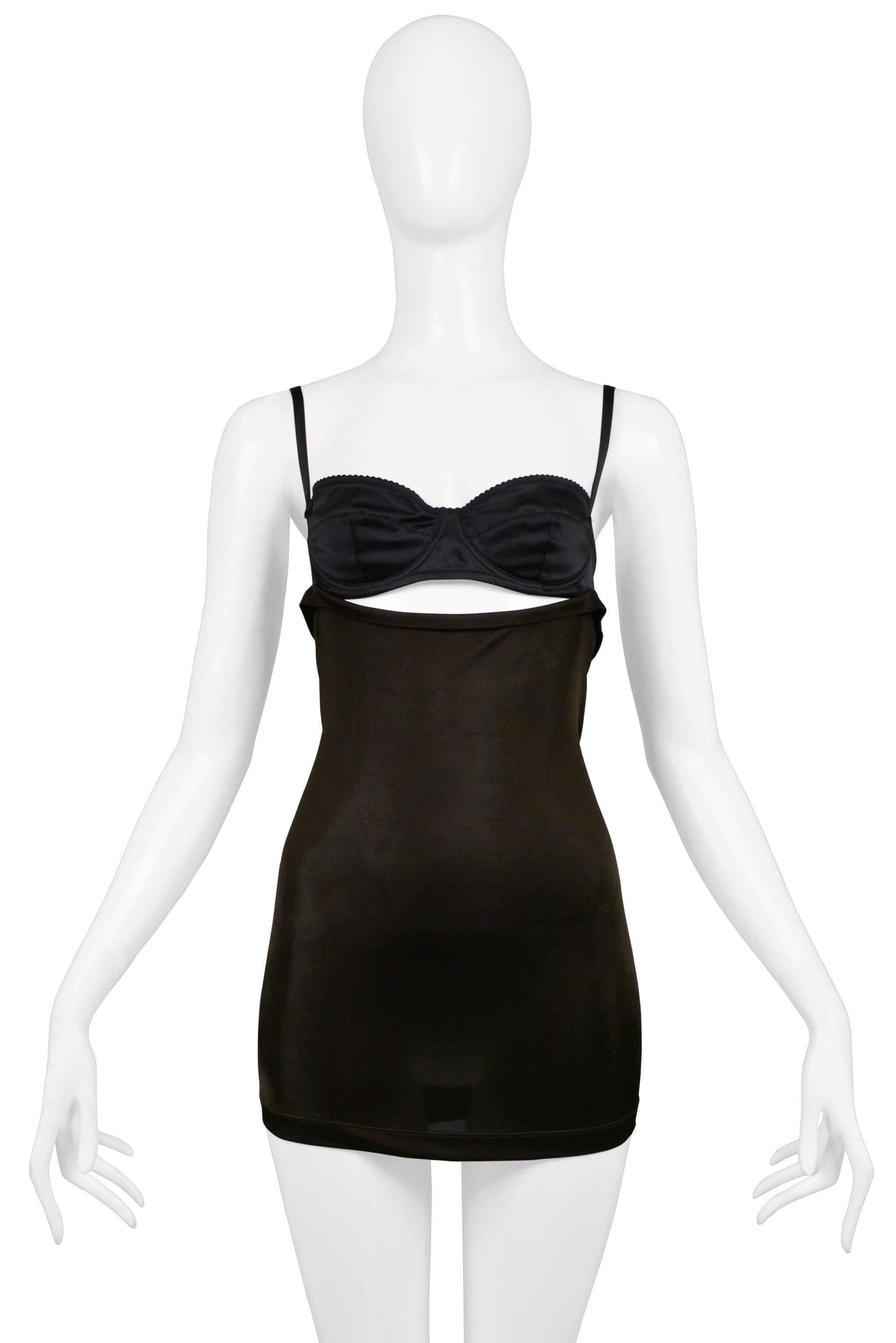 Resurrection Vintage is excited to offer a vintage Dolce & Gabbana cutout mini dress featuring a black bra top with adjustable straps and an attached brown slinky jersey skirt with a gathered back.

Dolce & Gabbana
Size 40
Silk Jersey, Satin
Very