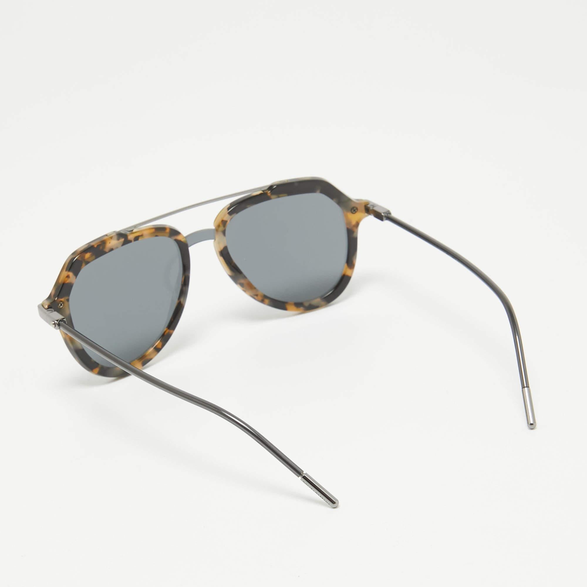 We see the detailing on this exquisite pair of designer sunglasses made from fine materials. The sunglasses are luxe in appeal and practical in usage.