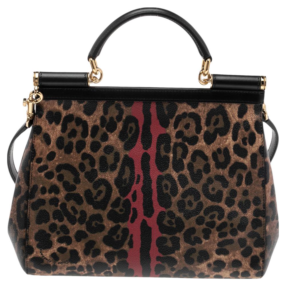 The iconic Miss Sicily bag by Dolce & Gabbana is one of the most loved designs from the brand. The elegant silhouette is made from leopard-printed canvas as well as leather and features a front flap accented with the logo plaque. The creation is