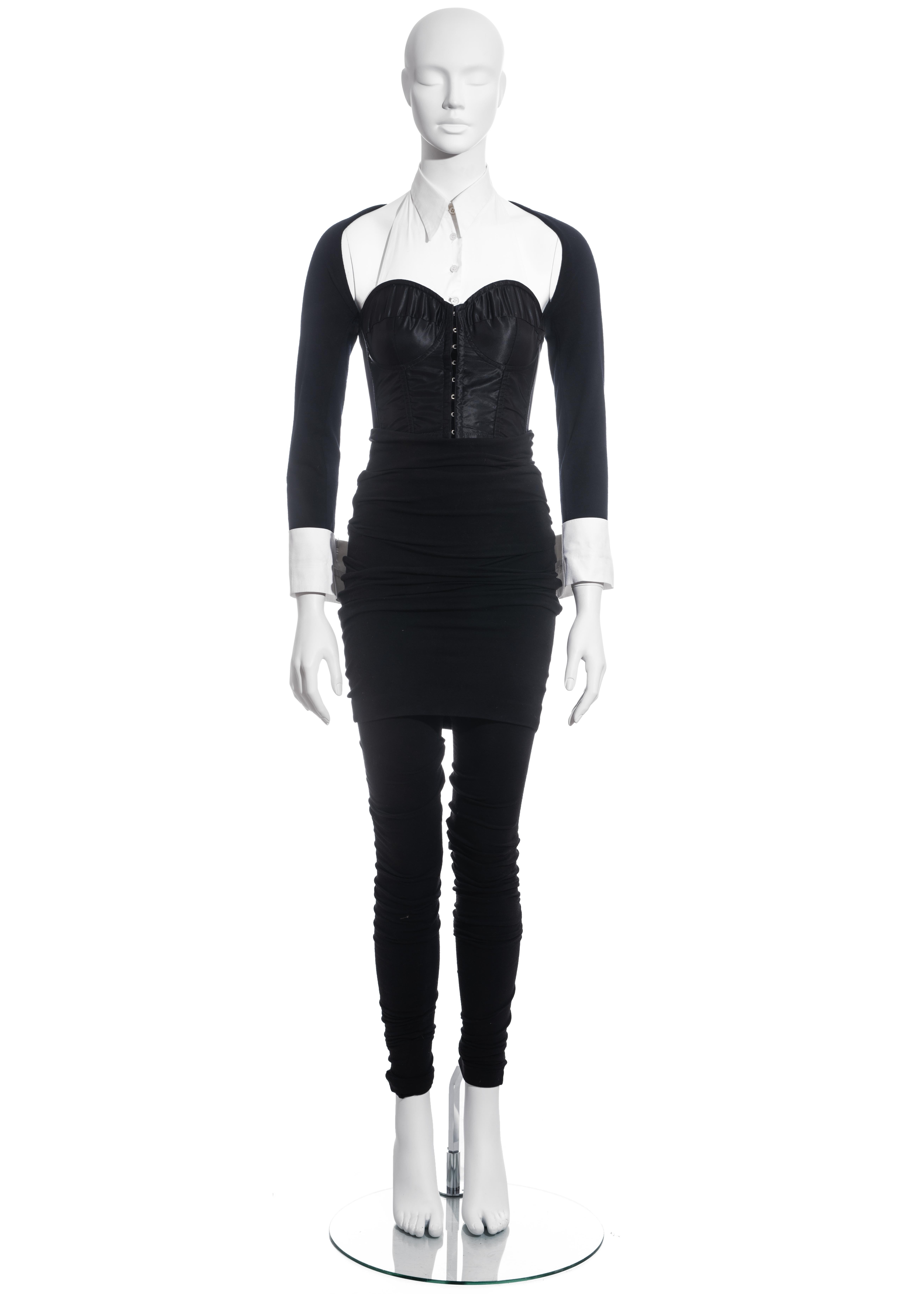 ▪ Dolce & Gabbana black corset suit
▪ Satin corset with attached white cotton shirt collar and cuffs
▪ Internal boning 
▪ Wool jersey sleeves 
▪ Extra long ruched wool jersey leggings with turn-over mini skirt 
▪ IT 40 - FR 36 - UK 8 - US 4
▪