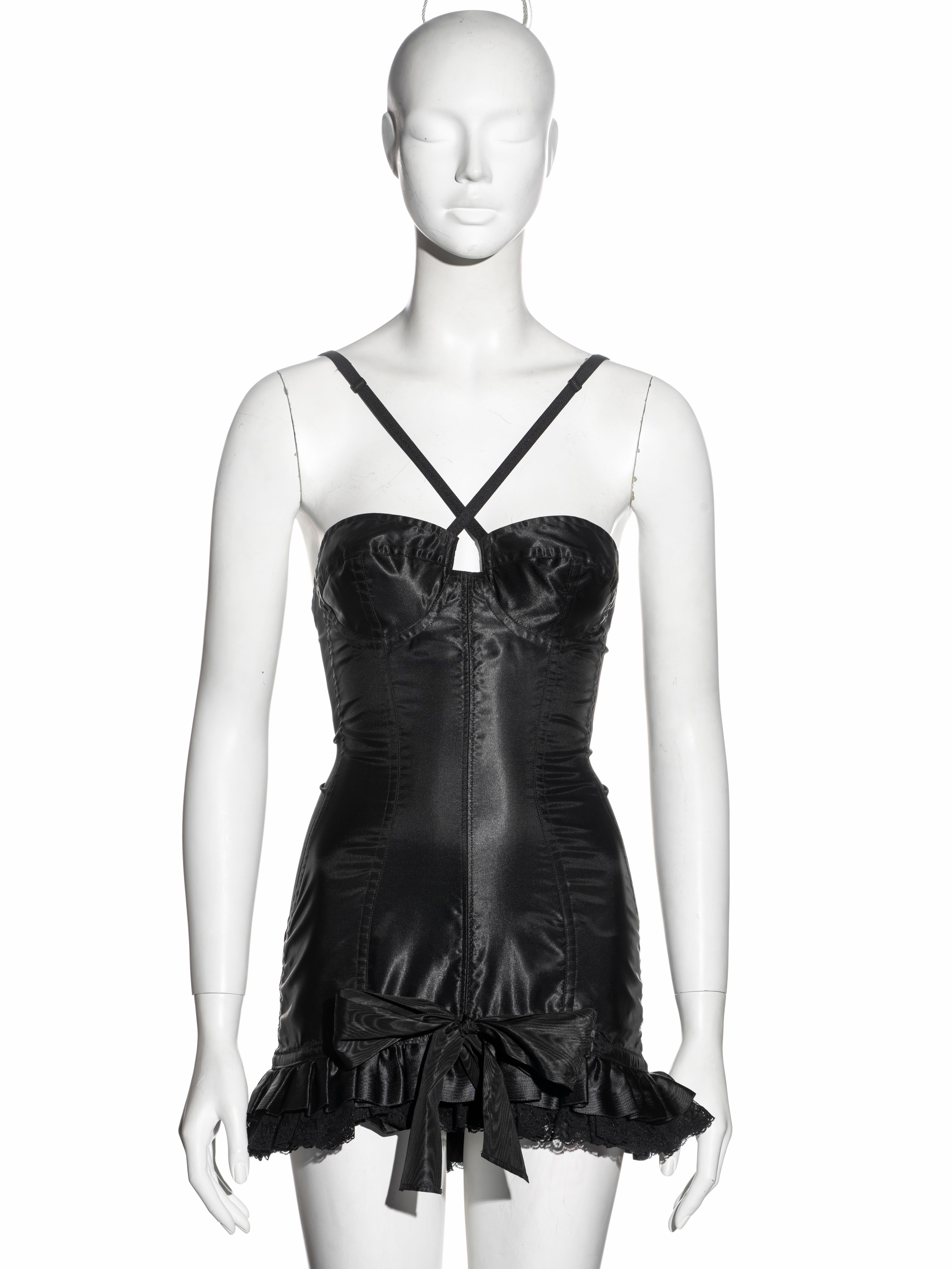 ▪ Dolce & Gabbana corset 'Pin-Up' mini dress
▪ Black satin and spandex 
▪ Ruffled hem with lace underlay 
▪ Moiré ribbon bow 
▪ Metal corset hooks at the centre-back opening 
▪ Adjustable shoulder straps criss-cross at the front 
▪ IT 44 - FR 40 -